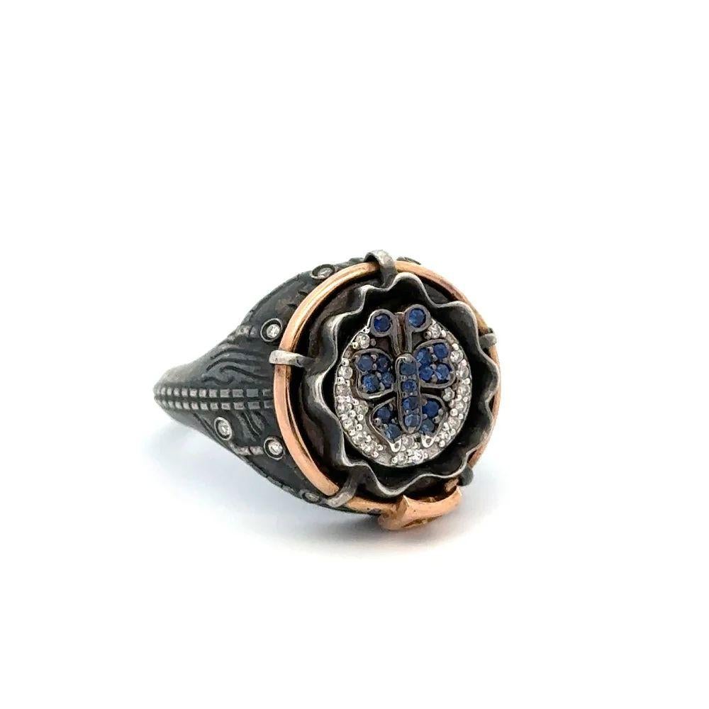 Simply Beautiful! Finely Detailed Sapphire and Diamond Butterfly Gold and Sterling Silver Statement Ring. Featuring a Hand set Blue Sapphire Butterfly, approx. 0.22tcw and accented with Diamonds, approx. 0.20tcw. Hand crafted in 18K Gold and