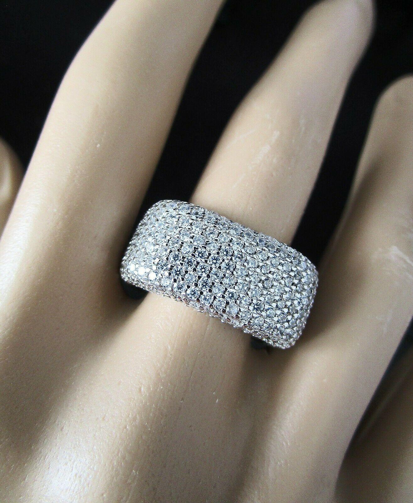 Simply Beautiful! Show Stopper Glistening Crystal Sterling Silver Cocktail Ring. Pave Hand set overall with 450 Sparkling AAA Ice CZ Cubic Zirconium all the way around. Beautifully crafted Square Sterling Silver mounting. Ring Size 8. Classic and