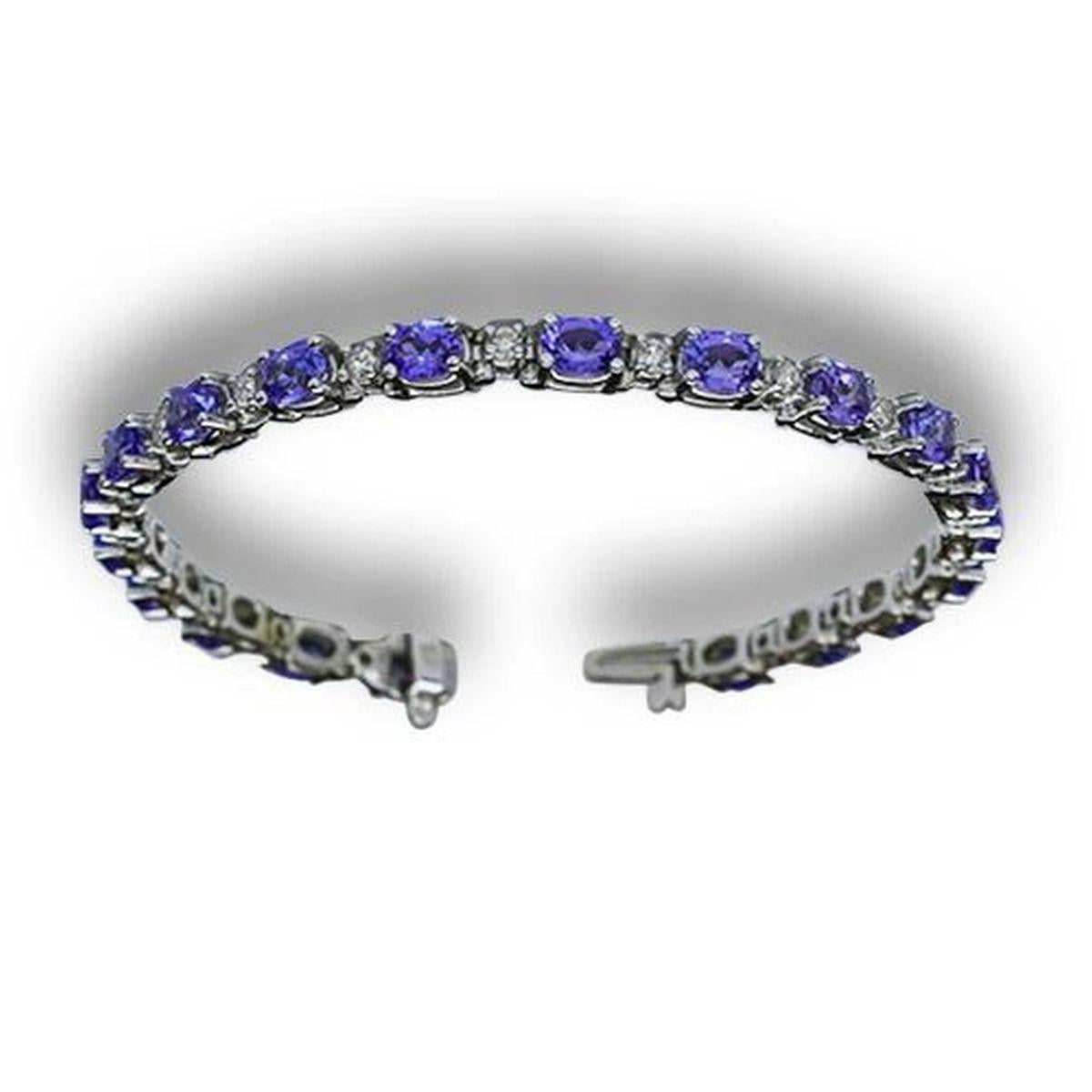 Simply Beautiful! Elegant and finely detailed Vintage Oscar Worthy Tanzanite and Diamond Gold Bracelet. Hand set with 20 Oval Blue/Violet Tanzanite I/F High Quality Gemstones, approx. 9.60tcw. Inter-spaced with Round Brilliant-cut Diamonds, approx.