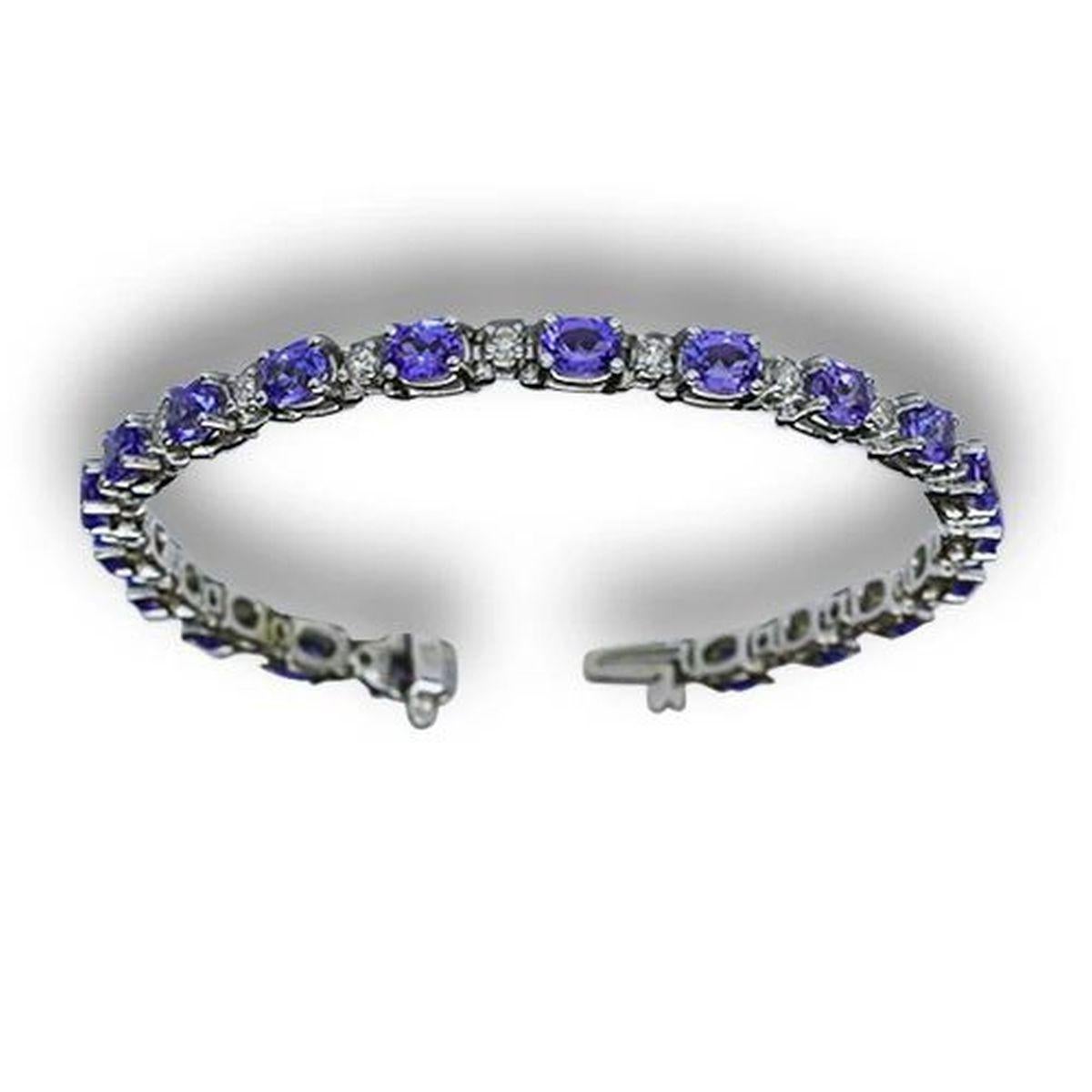 Semplicemente bello! Elegante e finemente dettagliato Bracciale d'oro Oscar Worthy con tanzanite e diamanti. Incastonate a mano 20 gemme ovali blu/viola di tanzanite I+I di alta qualità, circa 9,60tcw. Intervallati da diamanti rotondi taglio