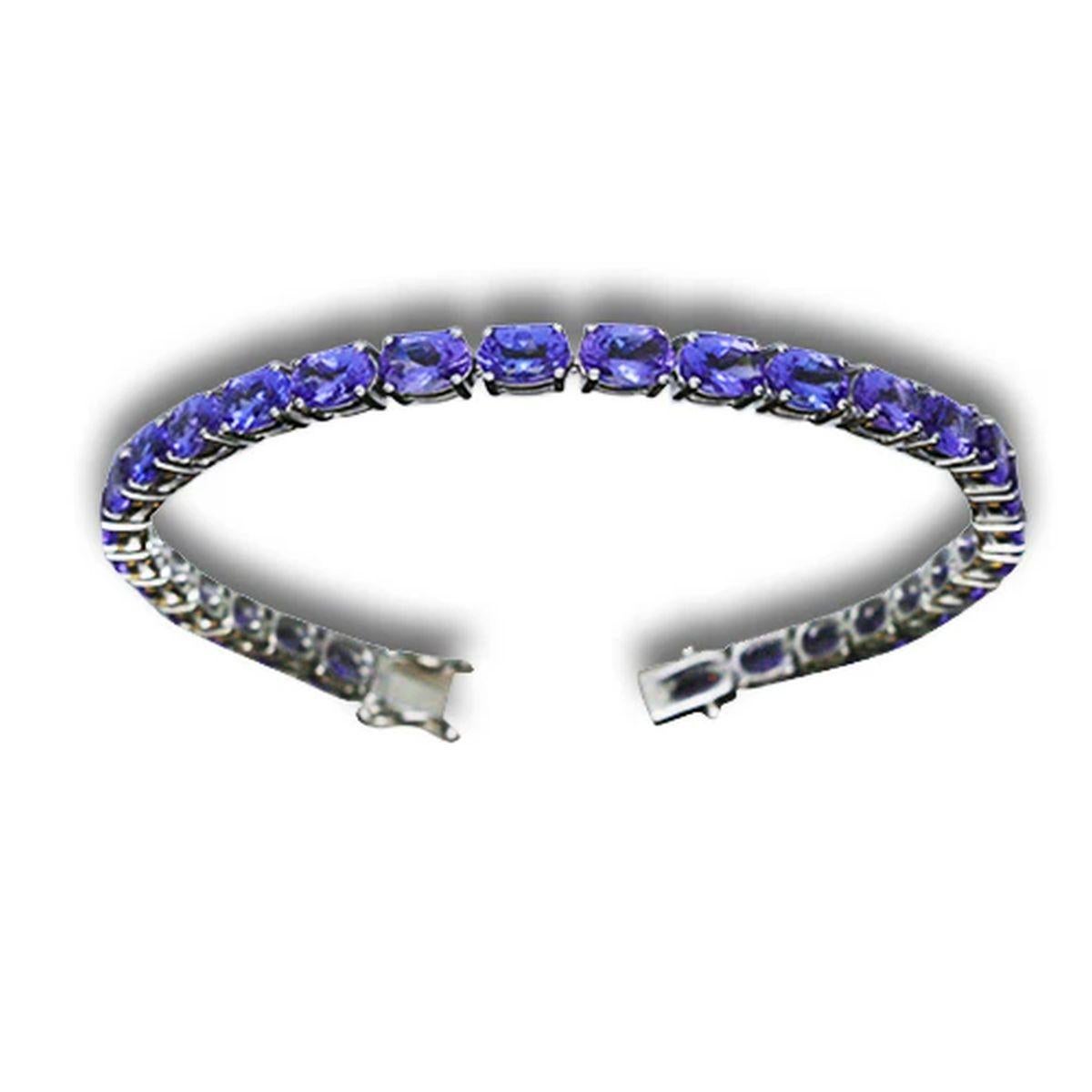 Semplicemente bello! Bracciale d'oro Oscar Worthy, elegante e finemente dettagliato, con tanzanite e diamanti. Incastonato a mano con 29 pietre ovali blu/viola di tanzanite I+I di alta qualità, per un peso di circa 12,80tcw. Realizzato a mano in oro