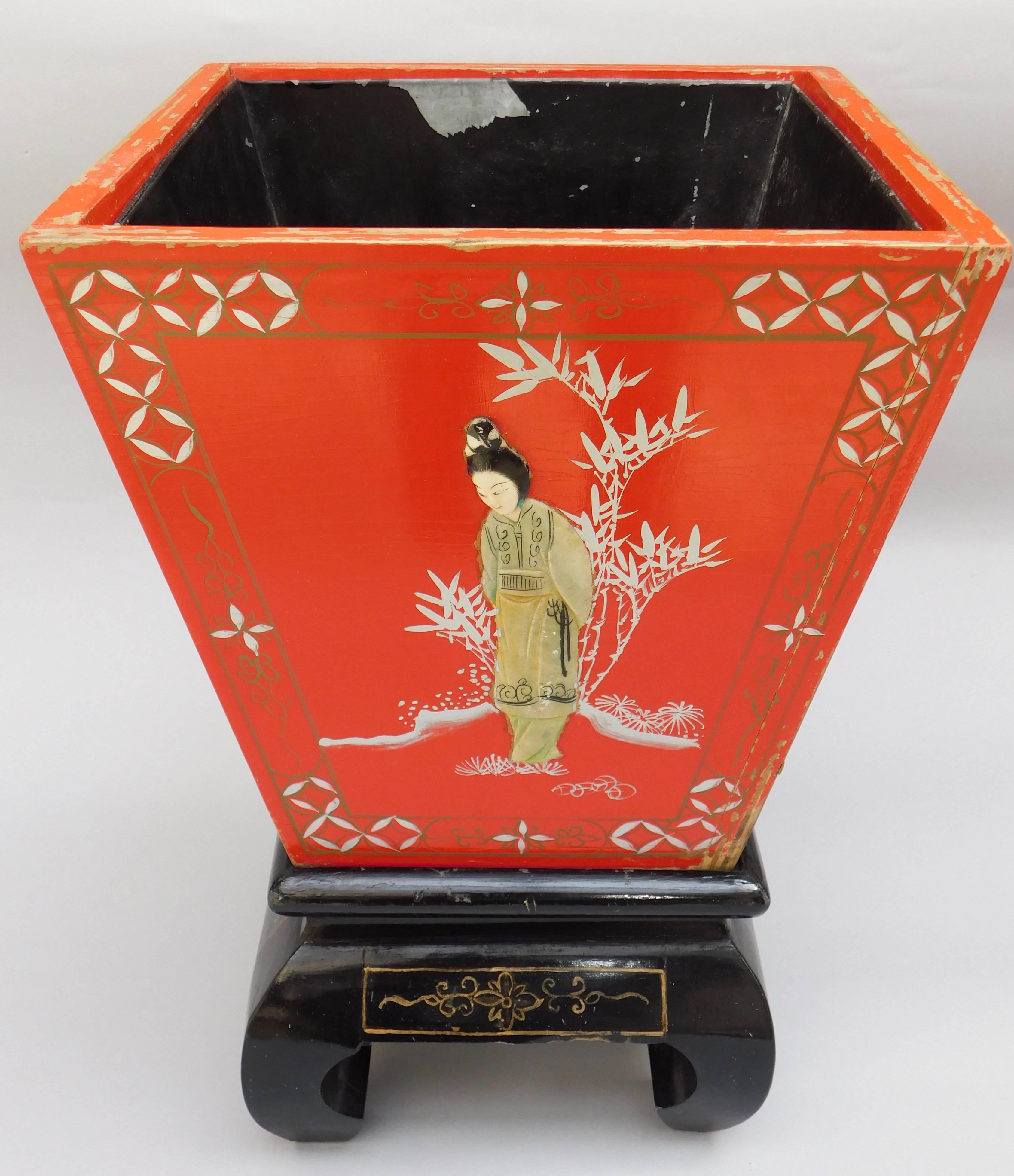Chinese export red lacquered wood container on stand with a lift-out tin liner, circa 1960. Chinoiserie painted decoration with applied figures of ladies hand carved in soap stone.
Originally meant to be used as a planter, but I think it would make