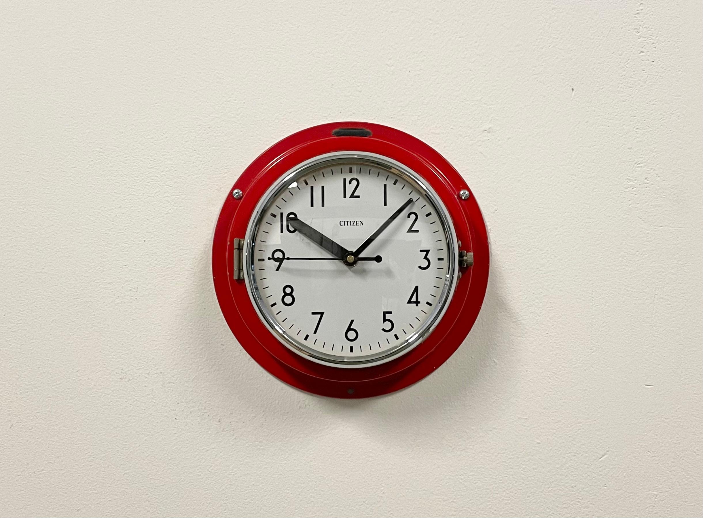 Vintage Citizen navy slave clock designed during the 1970s and produced till 1990s. These clocks were used on large Japanese tankers and cargo ships. It features a red metal frame, a plastic dial and curved clear glass cover. This item has been