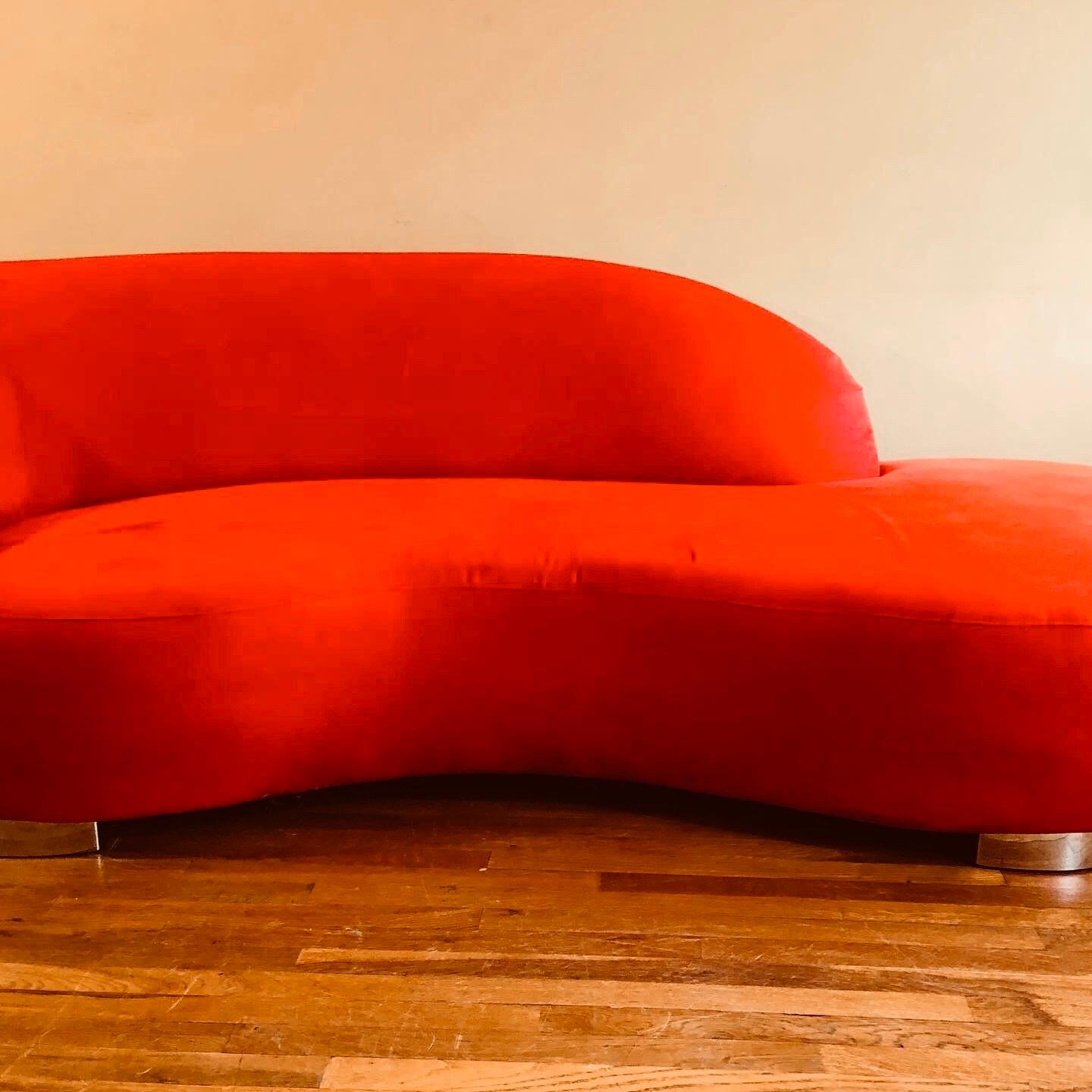 Lipstick red ultrasuede cloud sofa with chrome feet. One of Kagan's most recognizable designs. 



 