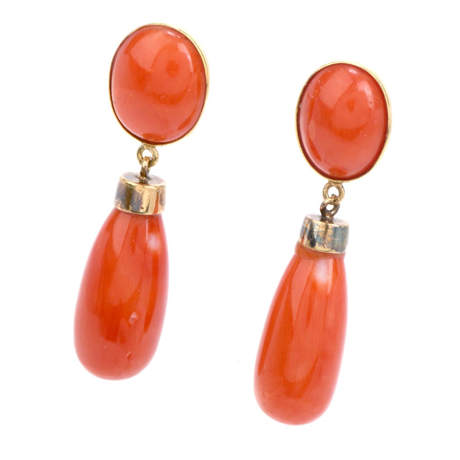 Decorate yourself with these warm and inviting Vintage Red Coral 18K Gold Drop Dangle Earrings!  These elegant earrings have two natural red coral oval cabochons near the top, and have two long drop shaped cabochons dangling at the bottom.  They are