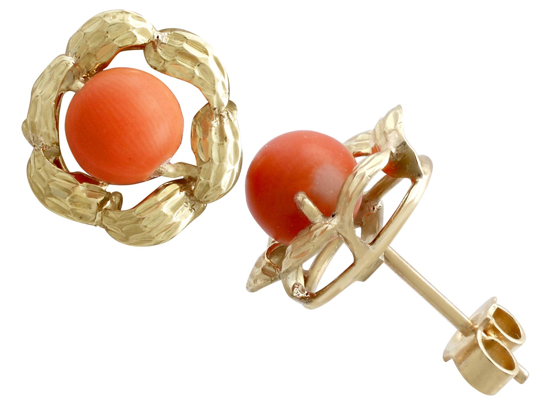 An impressive pair of vintage 1970s red coral and 18 karat yellow gold stud earrings; part of our diverse vintage jewelry and estate jewelry collections.

These fine and impressive red coral earrings have been crafted in 18k yellow gold.

Each of