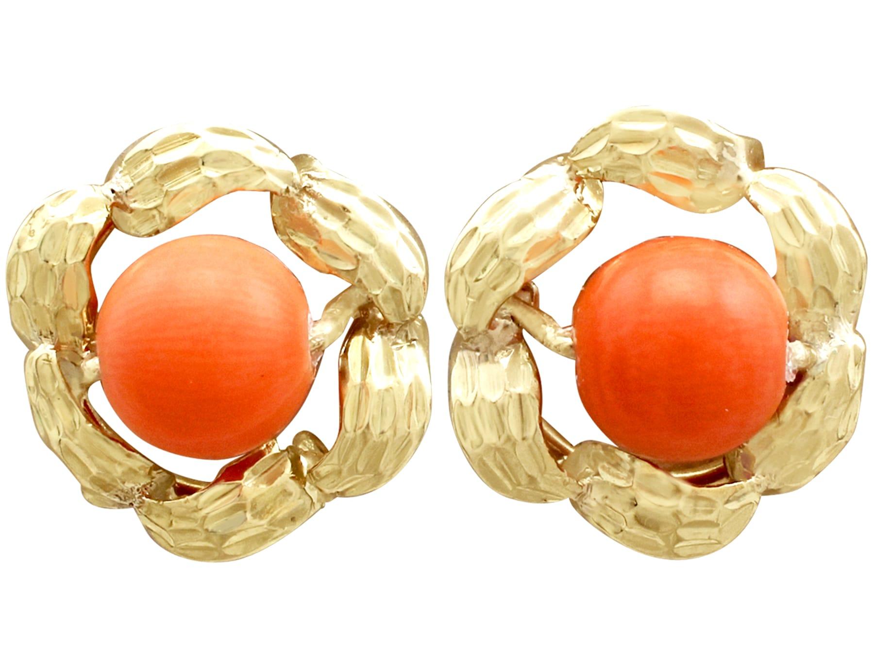 An impressive pair of vintage 1970s red coral and 18 karat yellow gold stud earrings; part of our diverse vintage jewelry and estate jewelry collections.

These fine and impressive red coral earrings have been crafted in 18k yellow gold.

Each of