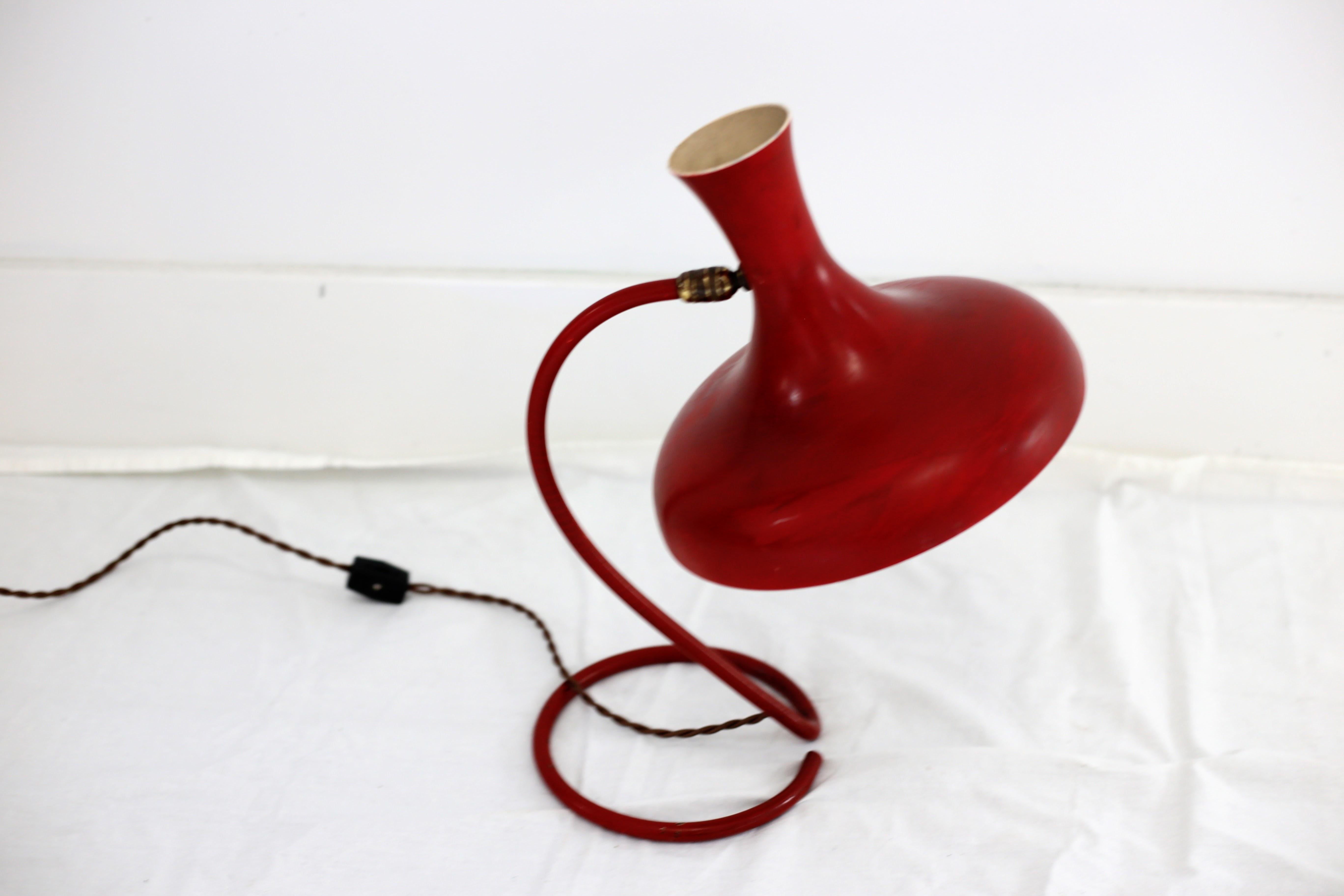 A good looking vintage midcentury red metal table or desk lamp with a gooseneck base and swivel mounted shade. The base measures 6