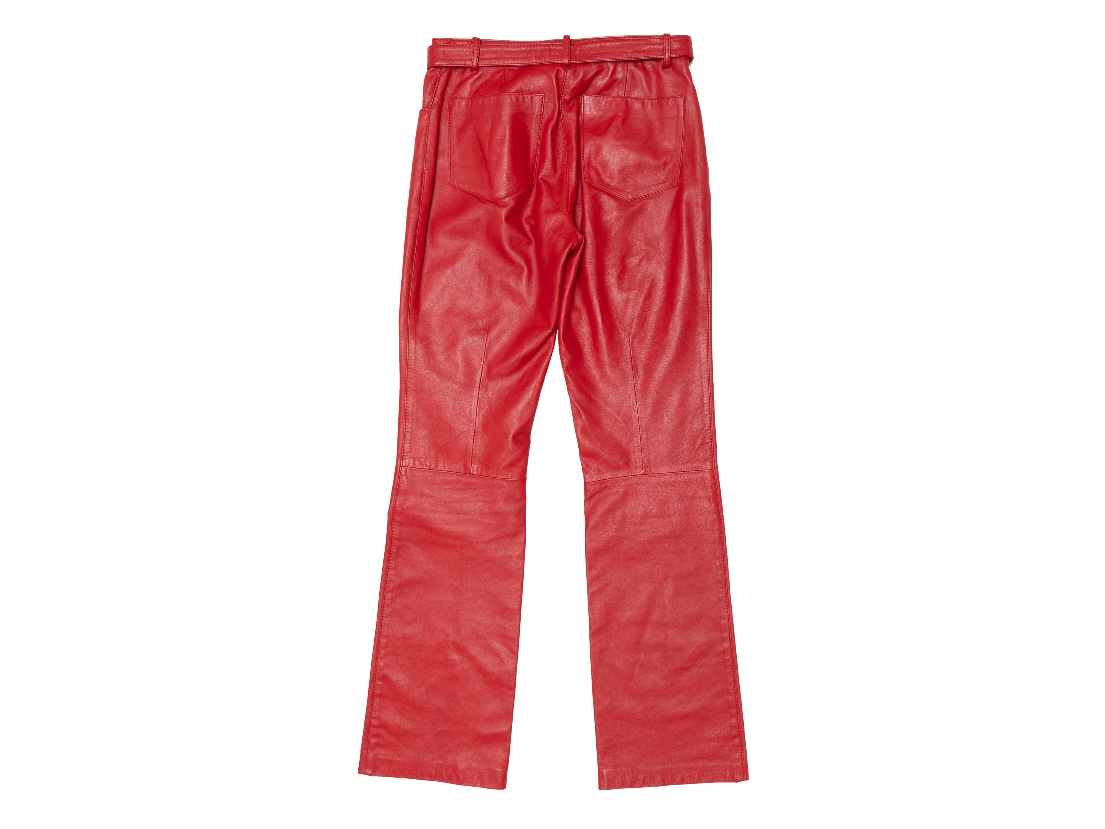 Vintage red leather pants by Dolce & Gabbana. Circa early 2000s. Five pockets. Front zip and snap closures at waist. 26