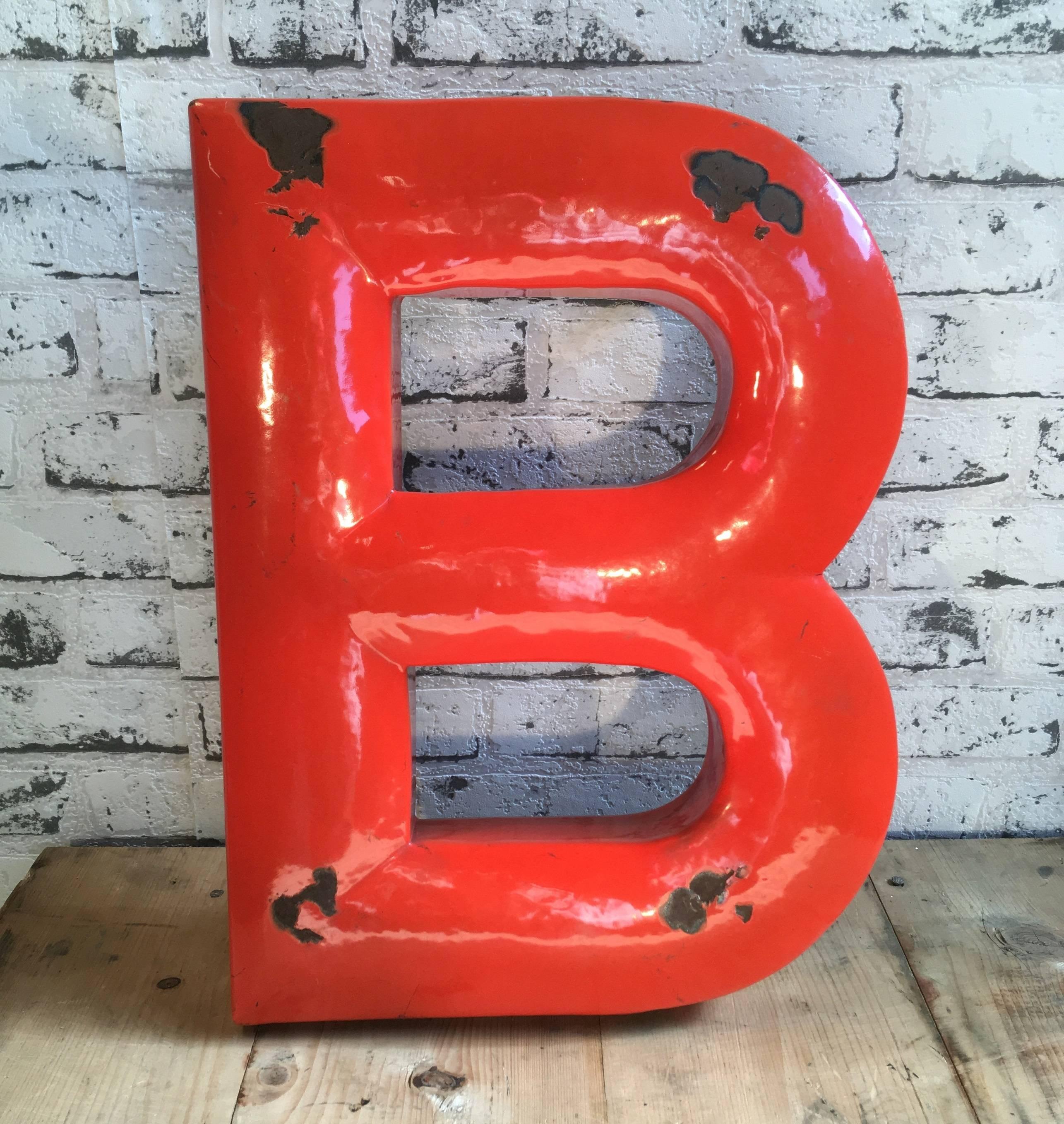 This industrial vintage letter 'B' was manufactured in former Czechoslovakia, 1930s.Comes from an old advertisement.
Letter is made from enamelled iron.