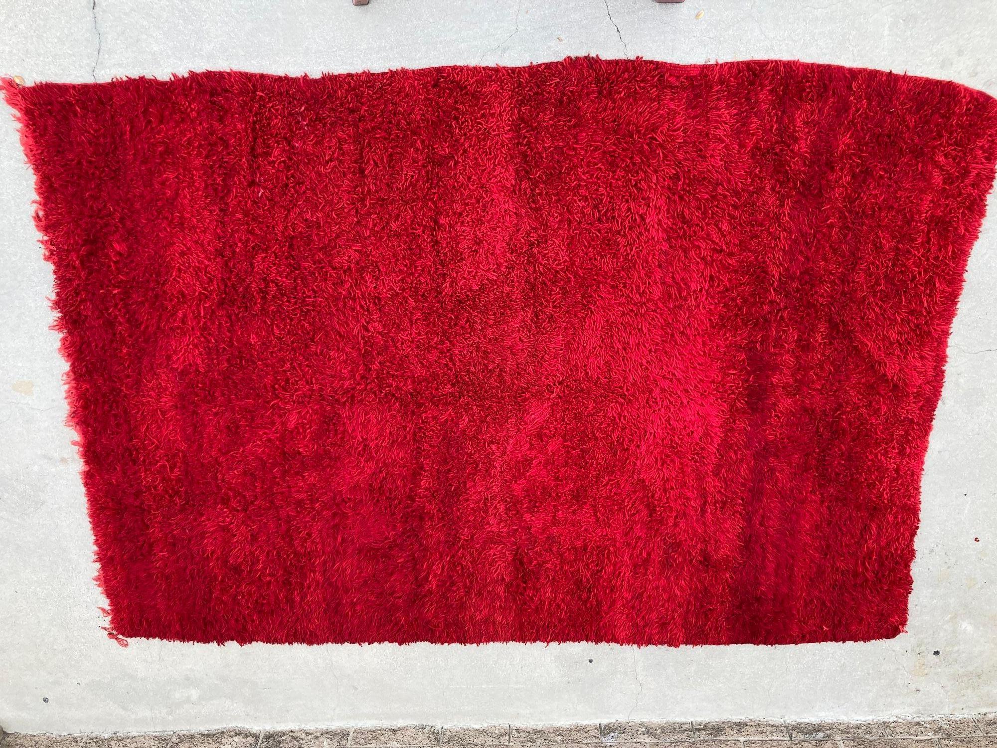 Vintage Red Ethnic Moroccan Fluffy Rug.Vintage authentic tribal Moroccan Berber rug from the Middle Atlas mountains. Monochromatic red ethnic African rug with variations in cor intensity typical for this tribe. This is a good example of Berber