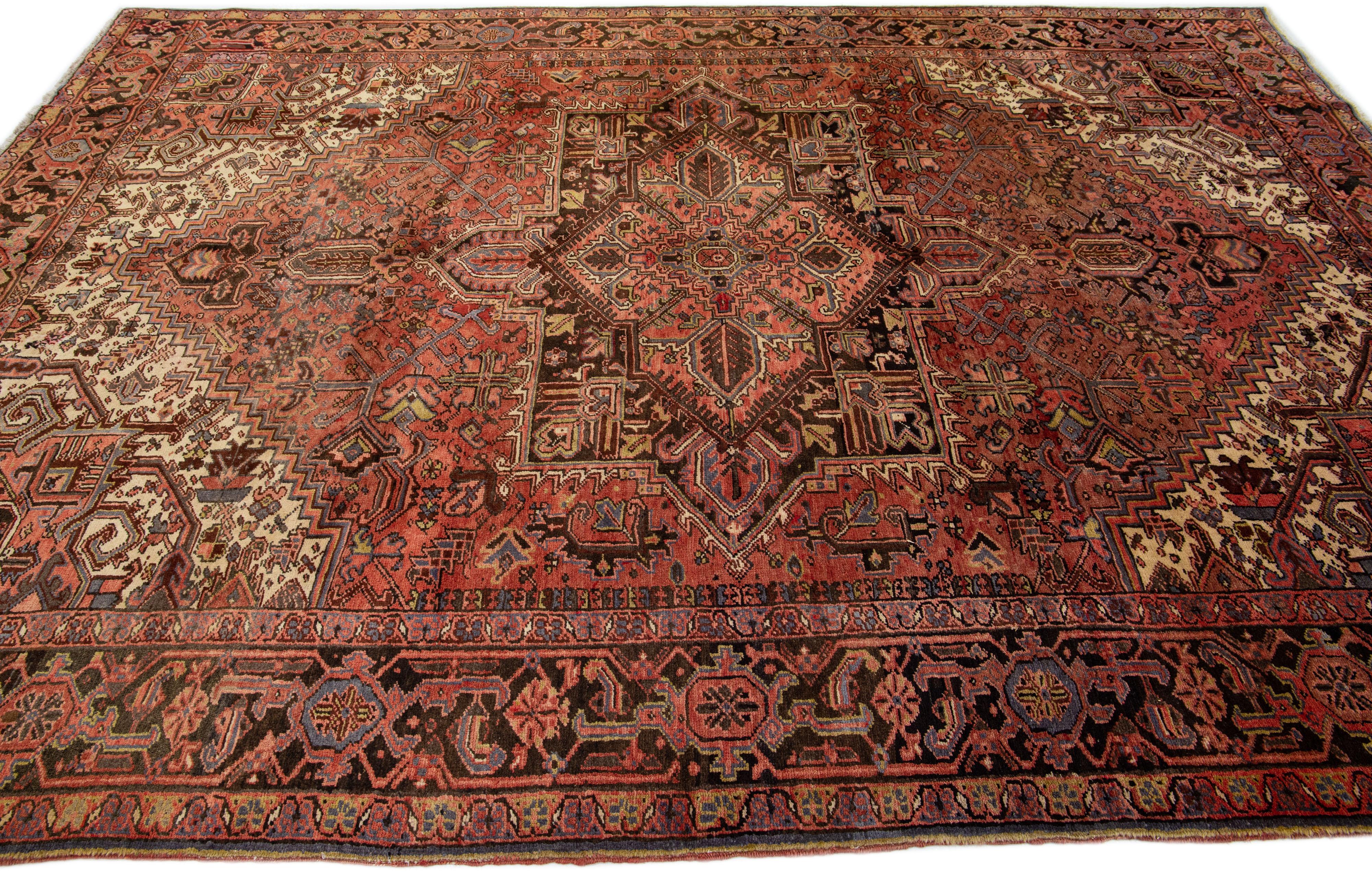 Persian Vintage Red Heriz Handmade Wool Rug with Medallion Motif For Sale