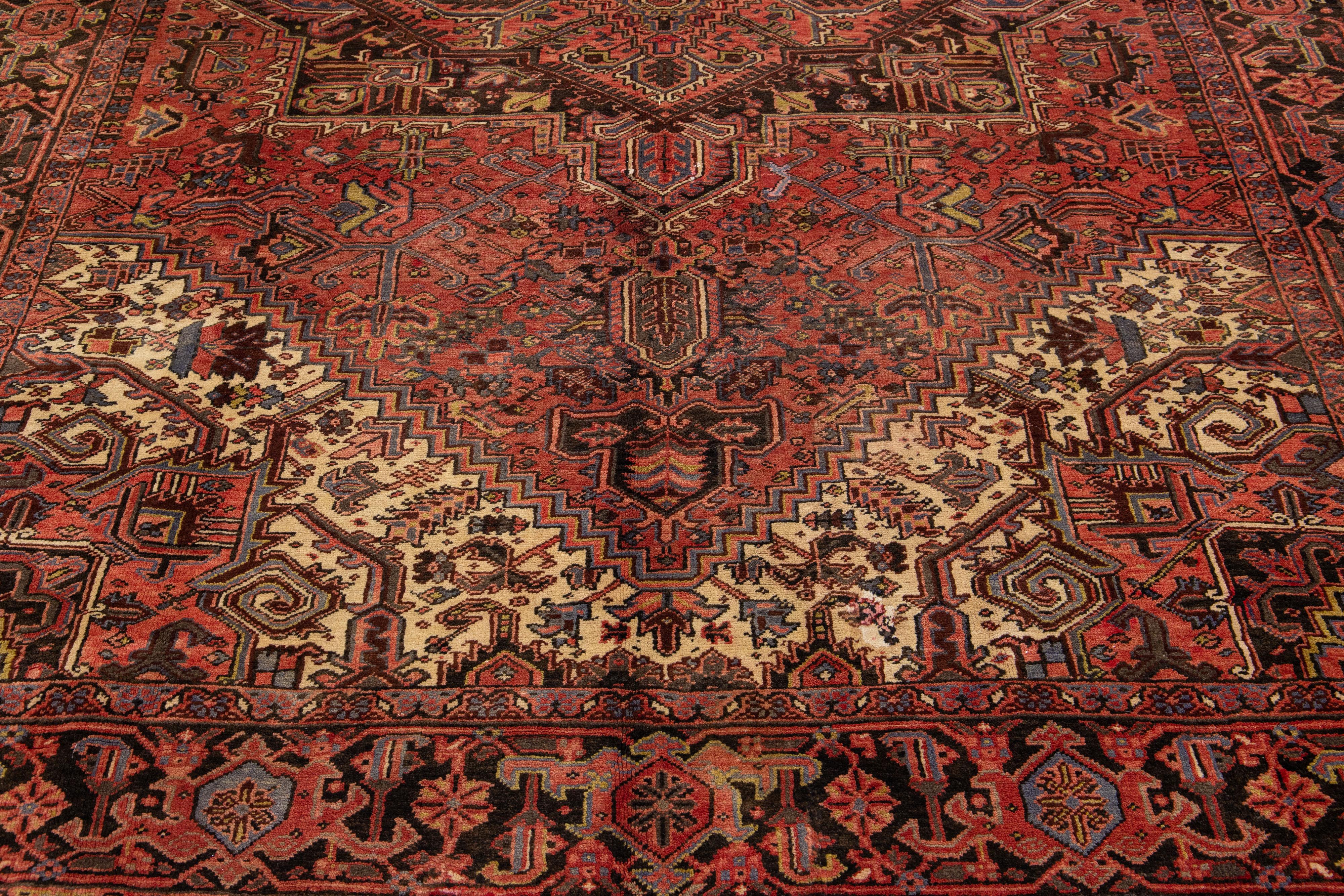 Vintage Red Heriz Handmade Wool Rug with Medallion Motif In Excellent Condition For Sale In Norwalk, CT