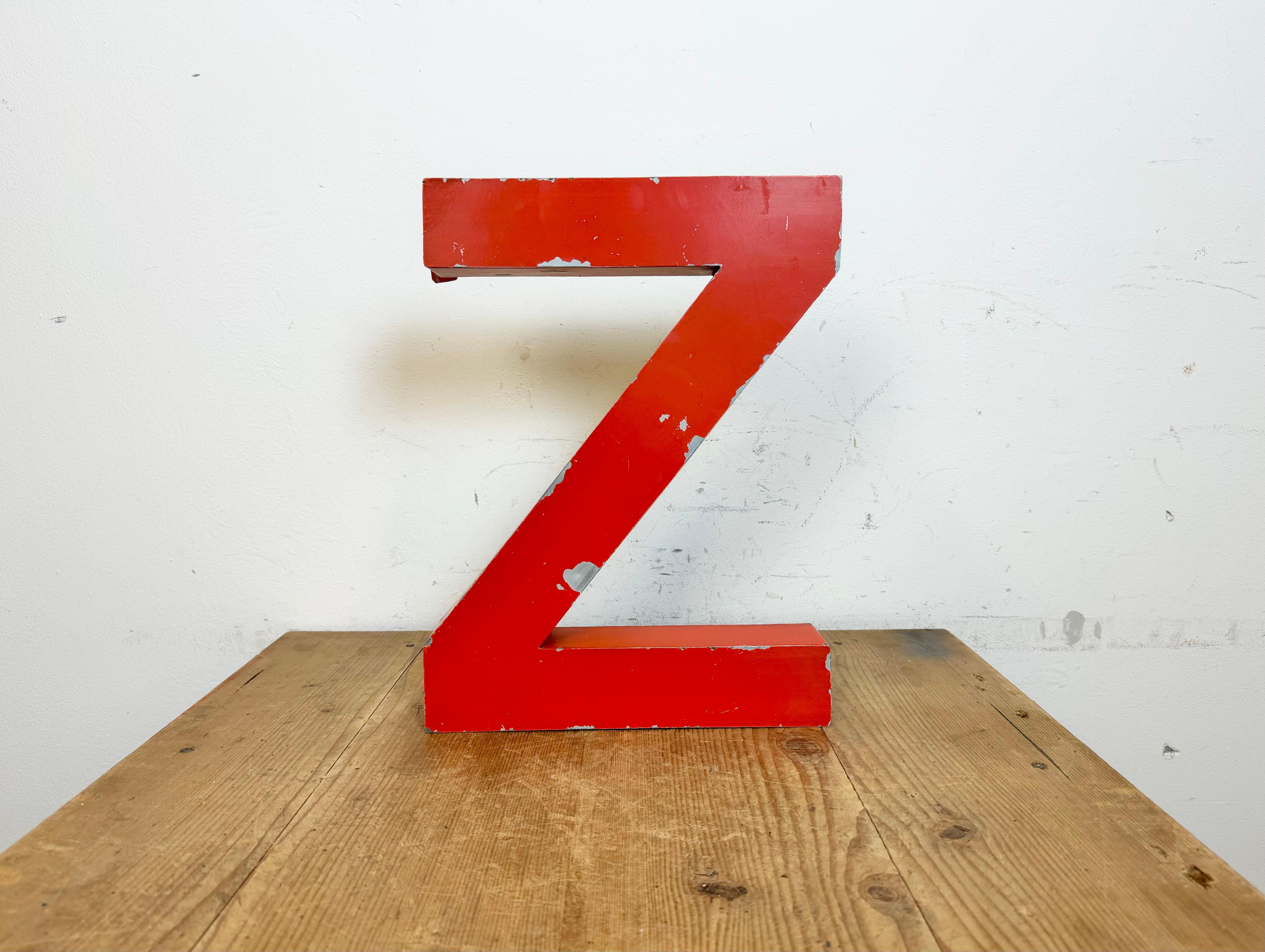 This vintage industrial facade letter “Z” was made during the 1970s in Italy and comes from an old advertising banner. The weight of the letter is 1 kg.