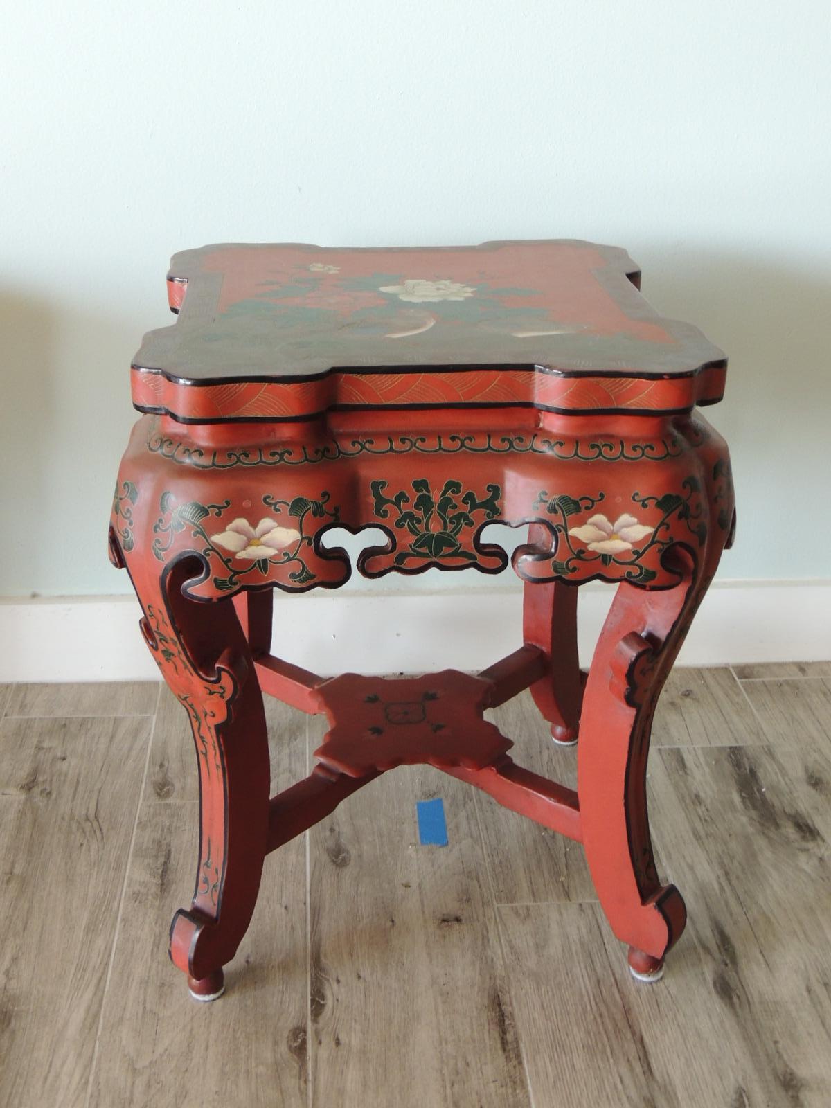 Red Chinese lacquer round side table or stool.
Intricate work depicting flowers and birds.
Could function as garden stool, side table, drinks table.
Size: 19