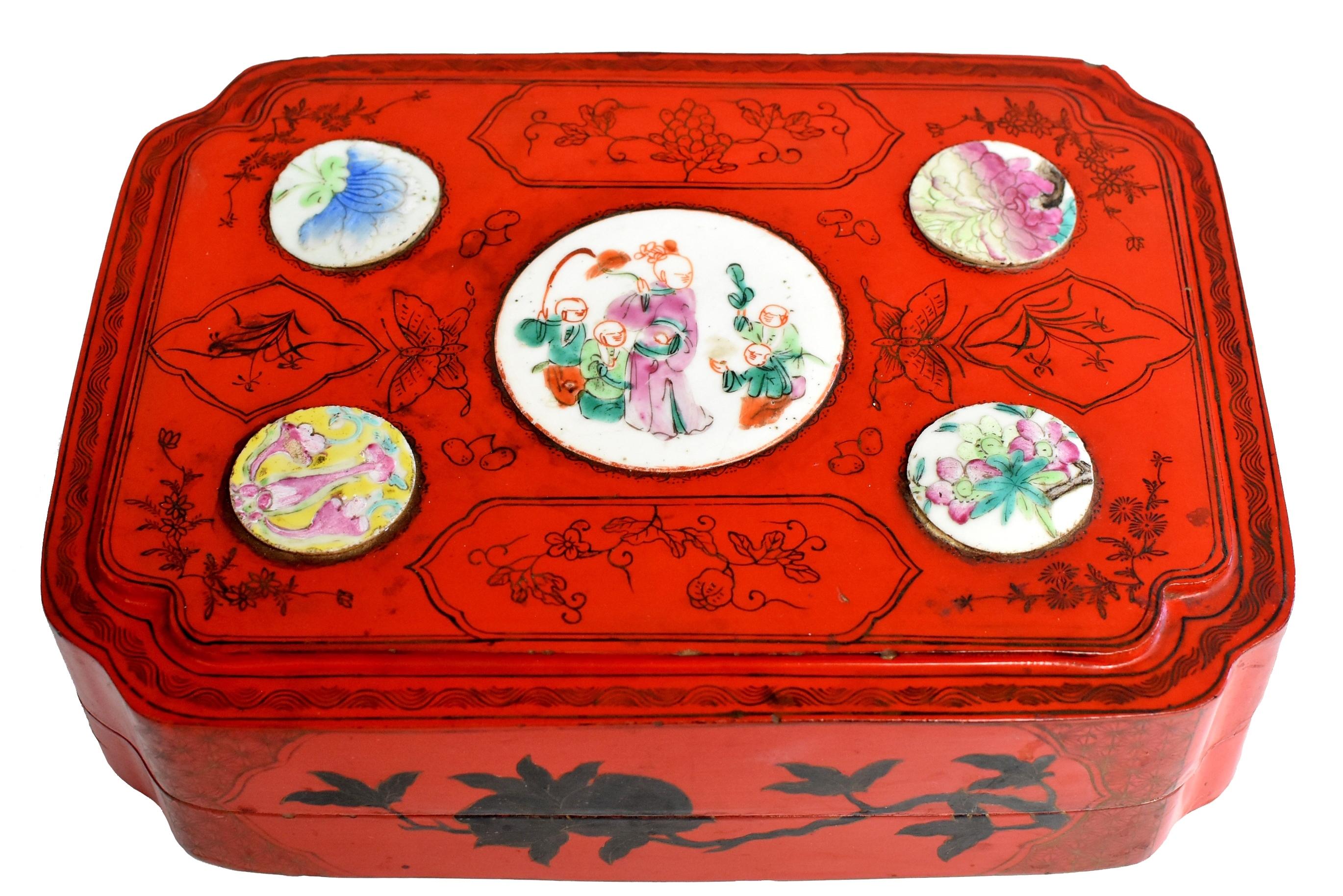 Beautiful red lacquered box feature 5 medallions of antique hand painted porcelain. Delicate ink paintings depict various flowers and butterflies which are symbols of happiness and love. The flowers of peony, lotus, lily and prunus blossom symbolize