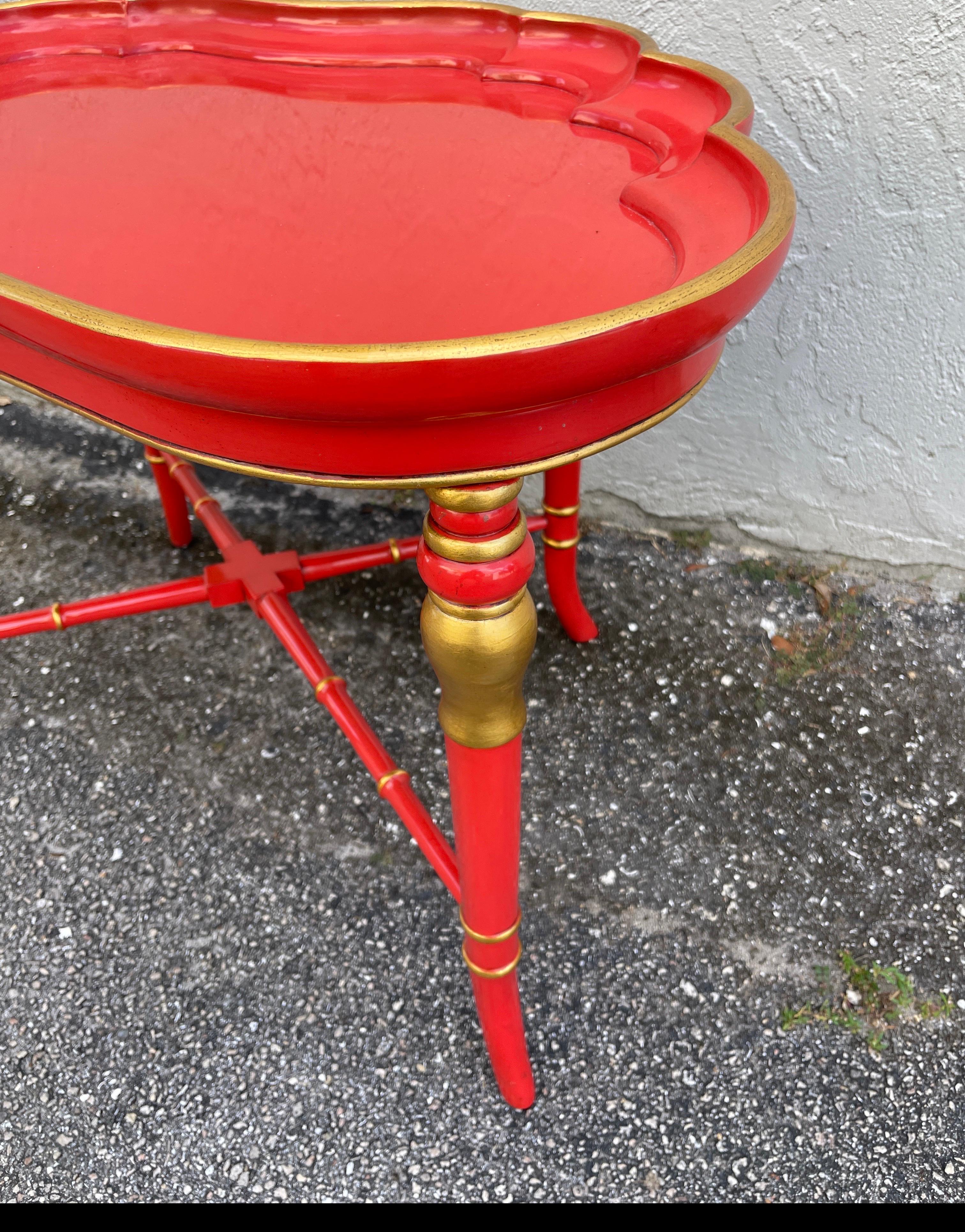 Vintage red lacquered and gilded cocktail table by Karges Furniture Company. In a kidney shape, this table will add glamour to any setting.