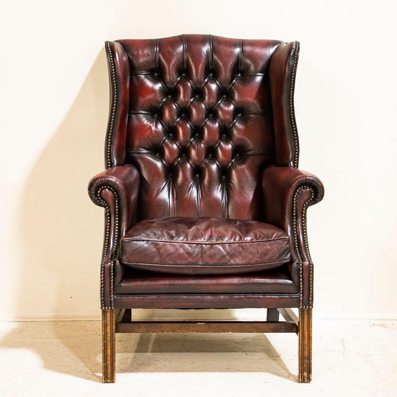 Whether you are ready to read a good book or smoke a cigar, this chair invites one to sit back, relax and reflect. The 1920s era still lingers here, and beckons to you as well. This handsome wingback chair has a tufted back with rolled arms while