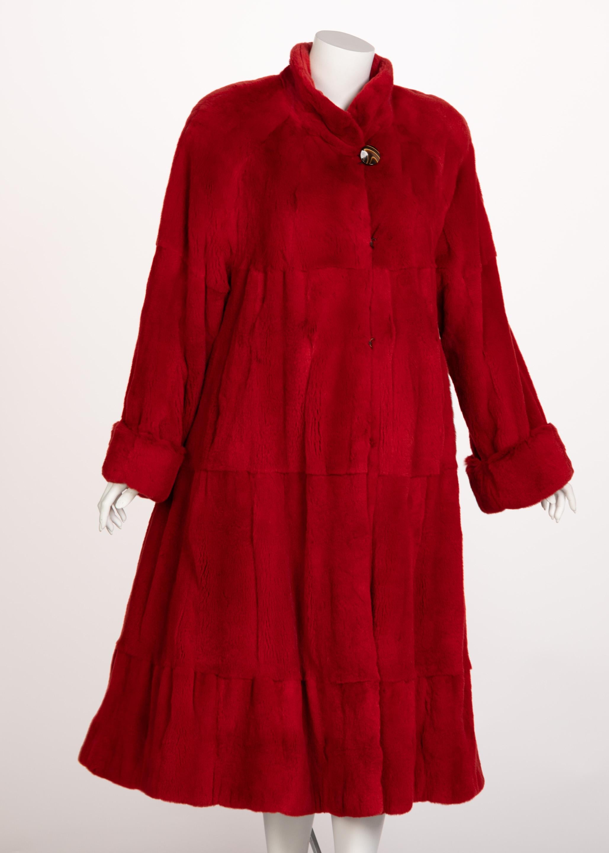 Mink has long since been associated with the luxury and status. A lush and lustrous fur, mink coats have for many years been an endearing treasure for winter style. This coat made from a vibrant red mink, possibly from the 80s or 90s, and is done in