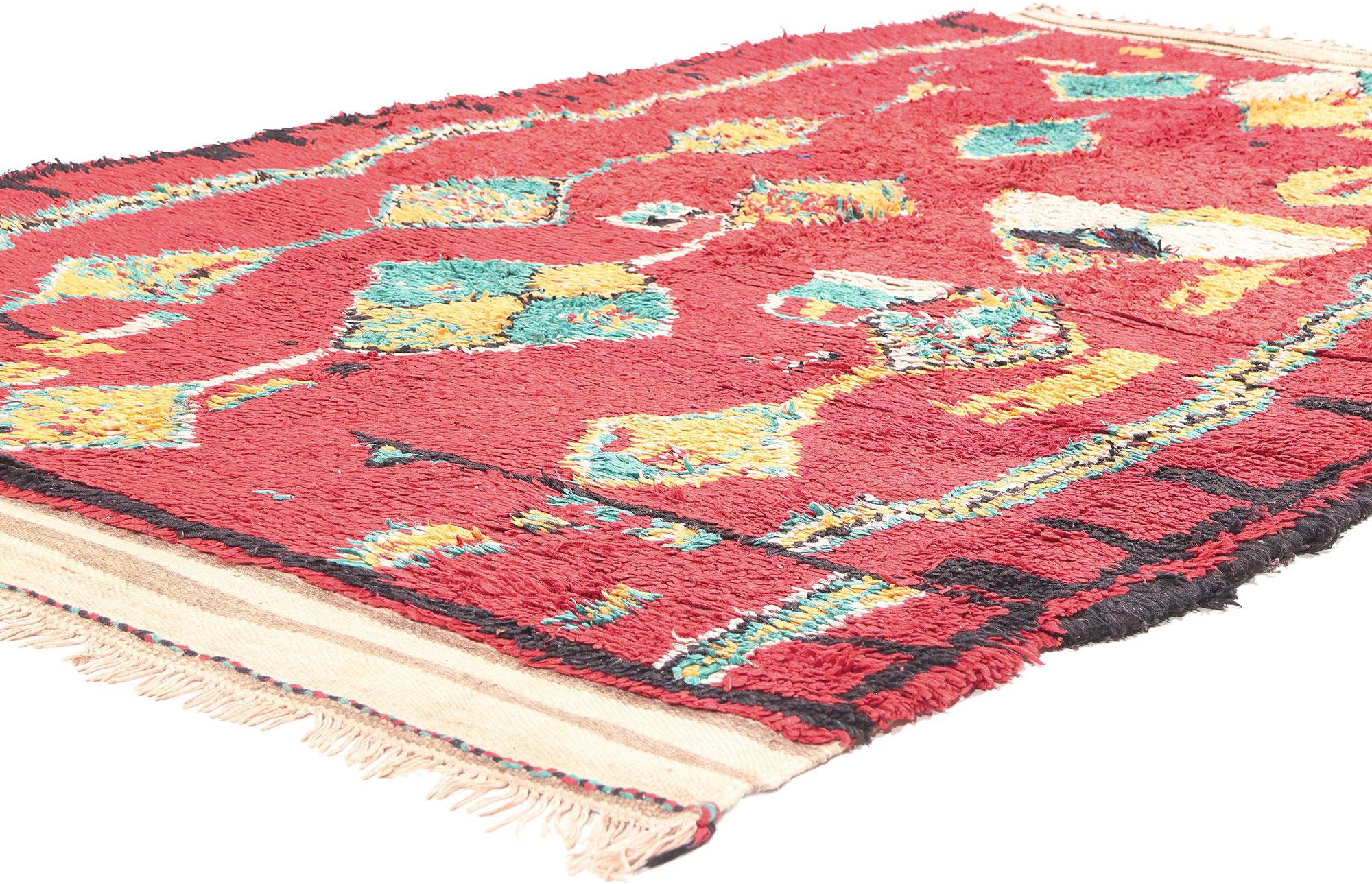 20484 Vintage Red Moroccan Rug, 04’10 x 07’00. In the intricate weave of this hand-knotted wool vintage red Moroccan rug, a profusion of diamonds and confetti-like sprinkles unfolds, framed by a ladder motif and vibrant colored stripes. The