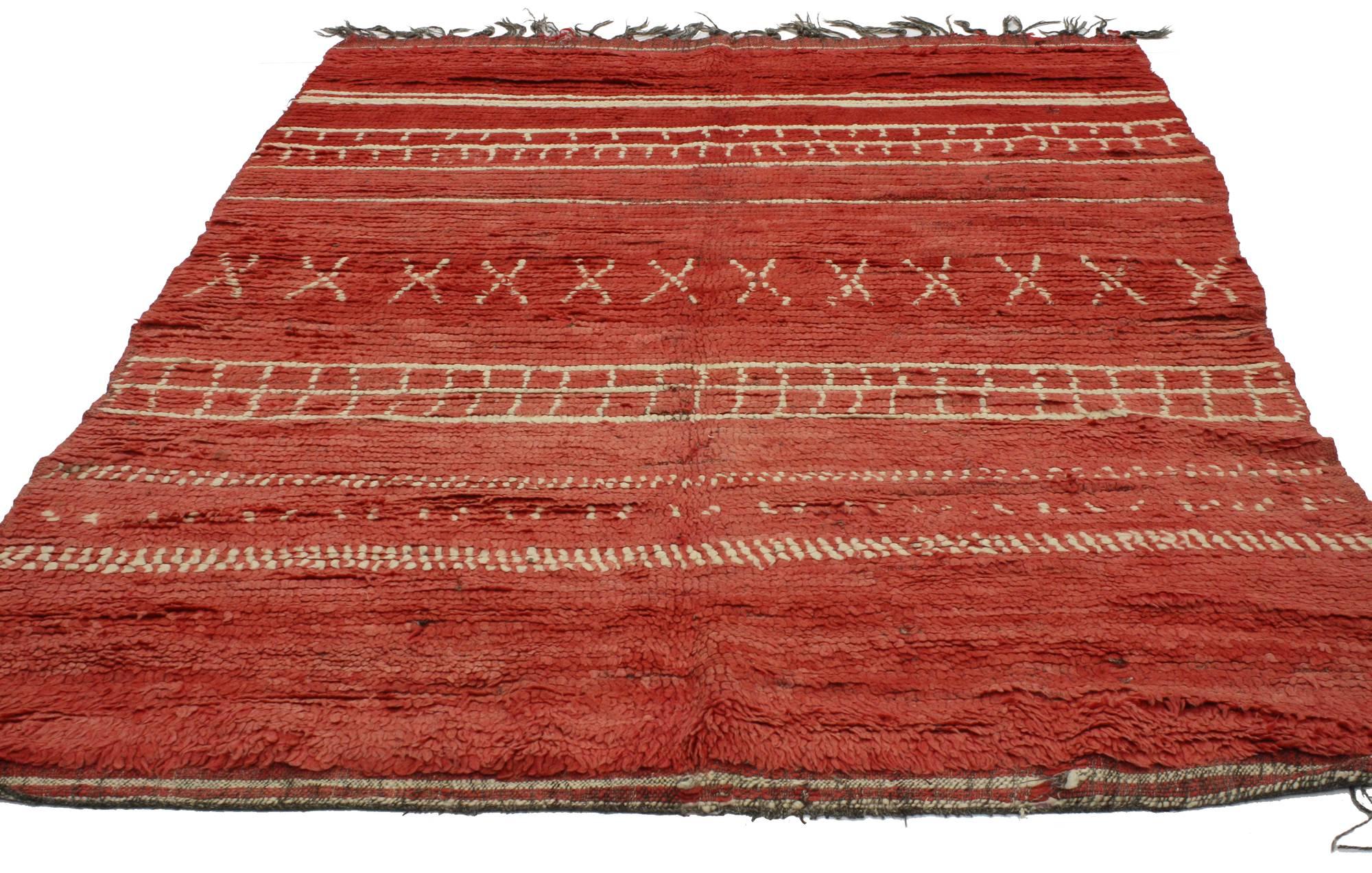 20268 vintage red Moroccan rug, Tribal Berber Moroccan rug. This hand knitted wool vintage Berber Moroccan rug features a variety of reproduction motifs. Taking center stage, a repeating band of X-shape motifs is flanked on either side with bands of