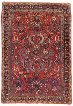 Alfombra vintage persa roja con flores Sarouk