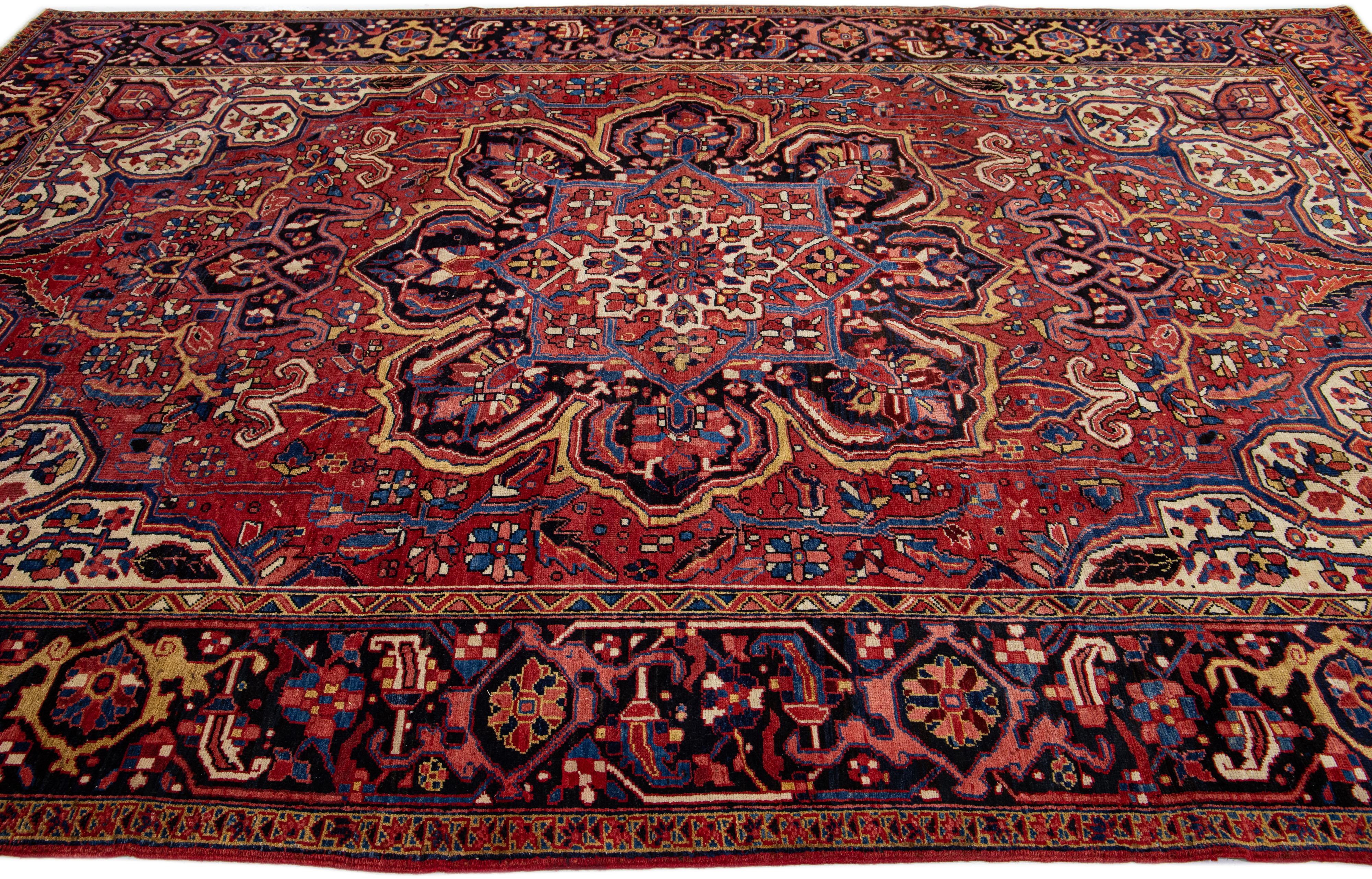 Hand-Knotted Vintage Red Persian Heriz Handmade Wool Rug with Medallion Motif For Sale