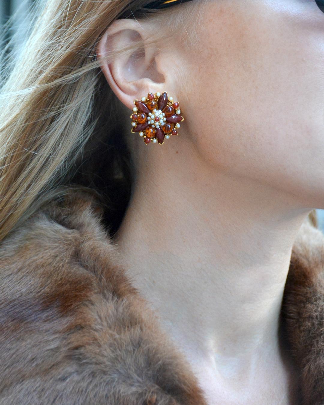 I adore these red floral cluster earrings— they remind me of a festive poinsettia flower, but the motif and palette are truly seasonless. A variety of rich shades of red, some of them in marble stones, are offset by delicate pearl details. They