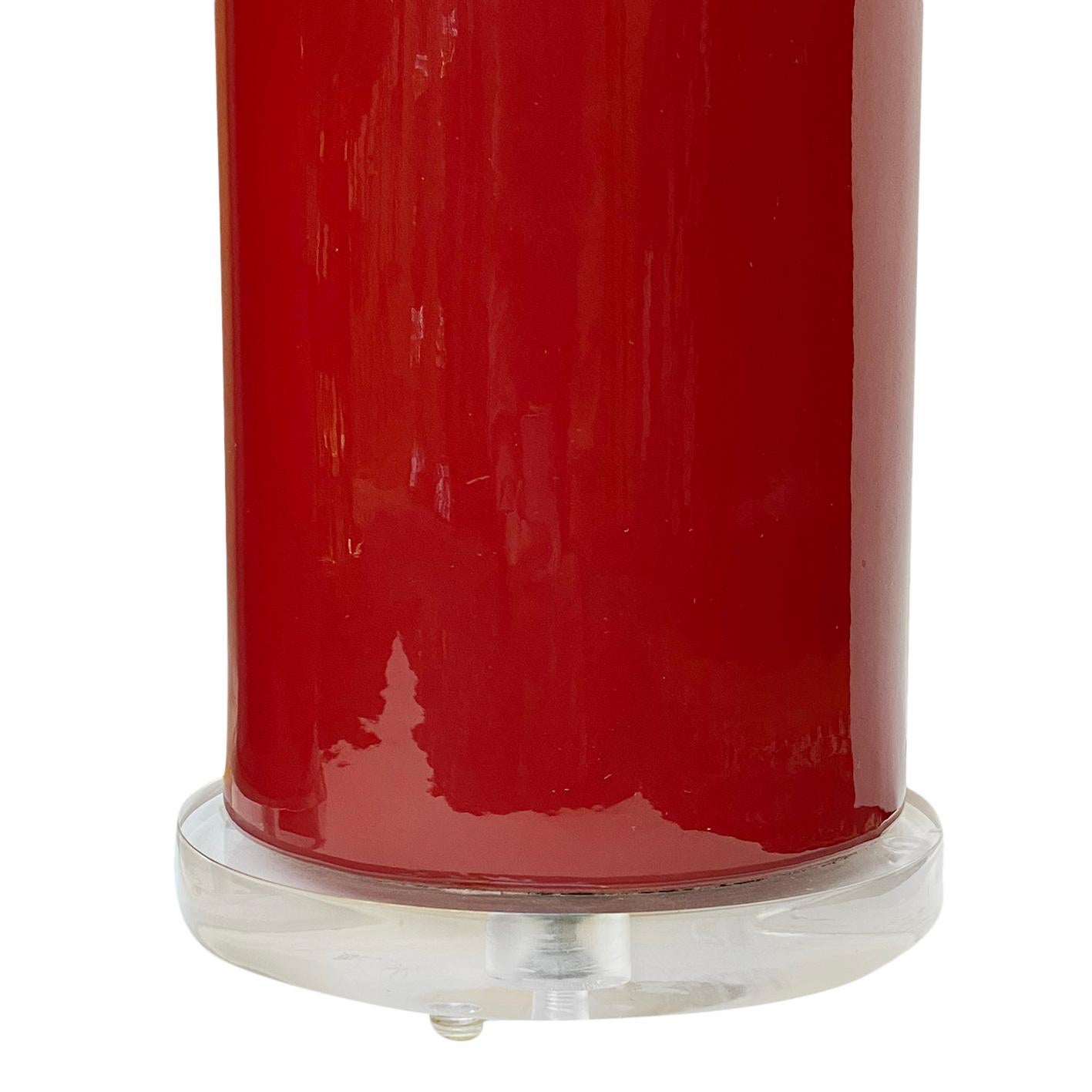 A pair of 1960's Italian red porcelain table lamps with lucite bases.

Measurements:
Height of body: 17.75