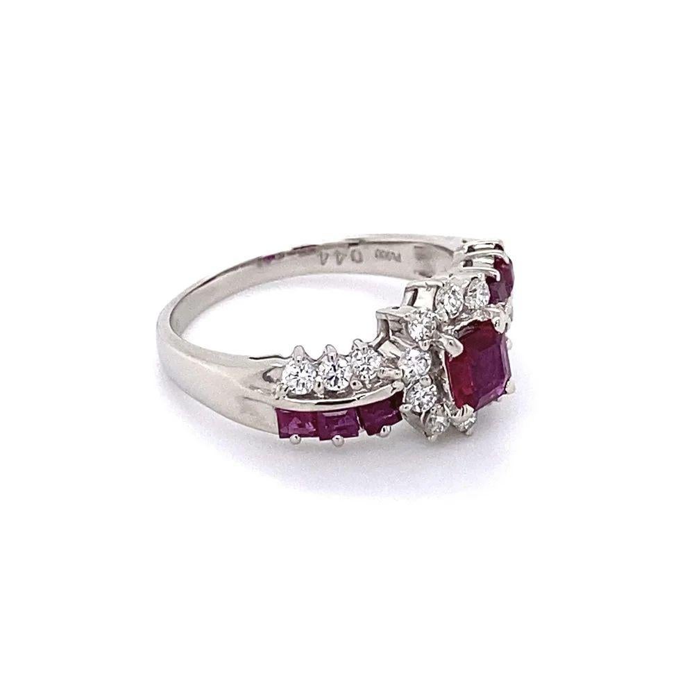 Simply Beautiful! Stylish and Finely detailed Vintage Ruby and Diamond Platinum Ring. Centering set a securely nestled Ruby, weighing approx. 0.44 Carat, surrounded by Diamonds, weighing approx. 0.59 Carats and further enhanced by Red Rubies,