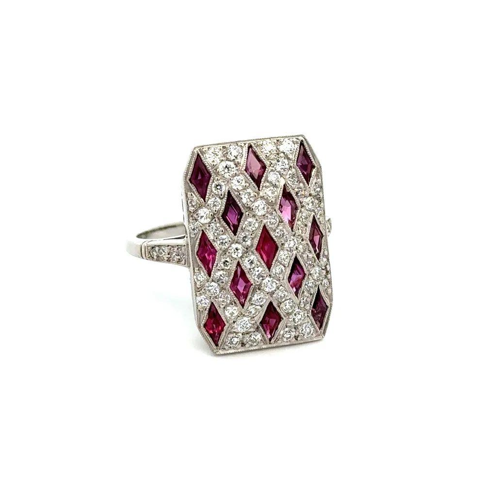 Simply Beautiful! Finely detailed Classic Kite Ruby and Diamond Platinum Cocktail Ring. Securely Hand set with Kite Rubies, weighing approx. 1.30tcw and Old European Cut Diamonds, approx. 1.36tcw. Hand crafted Platinum Shield design mounting making