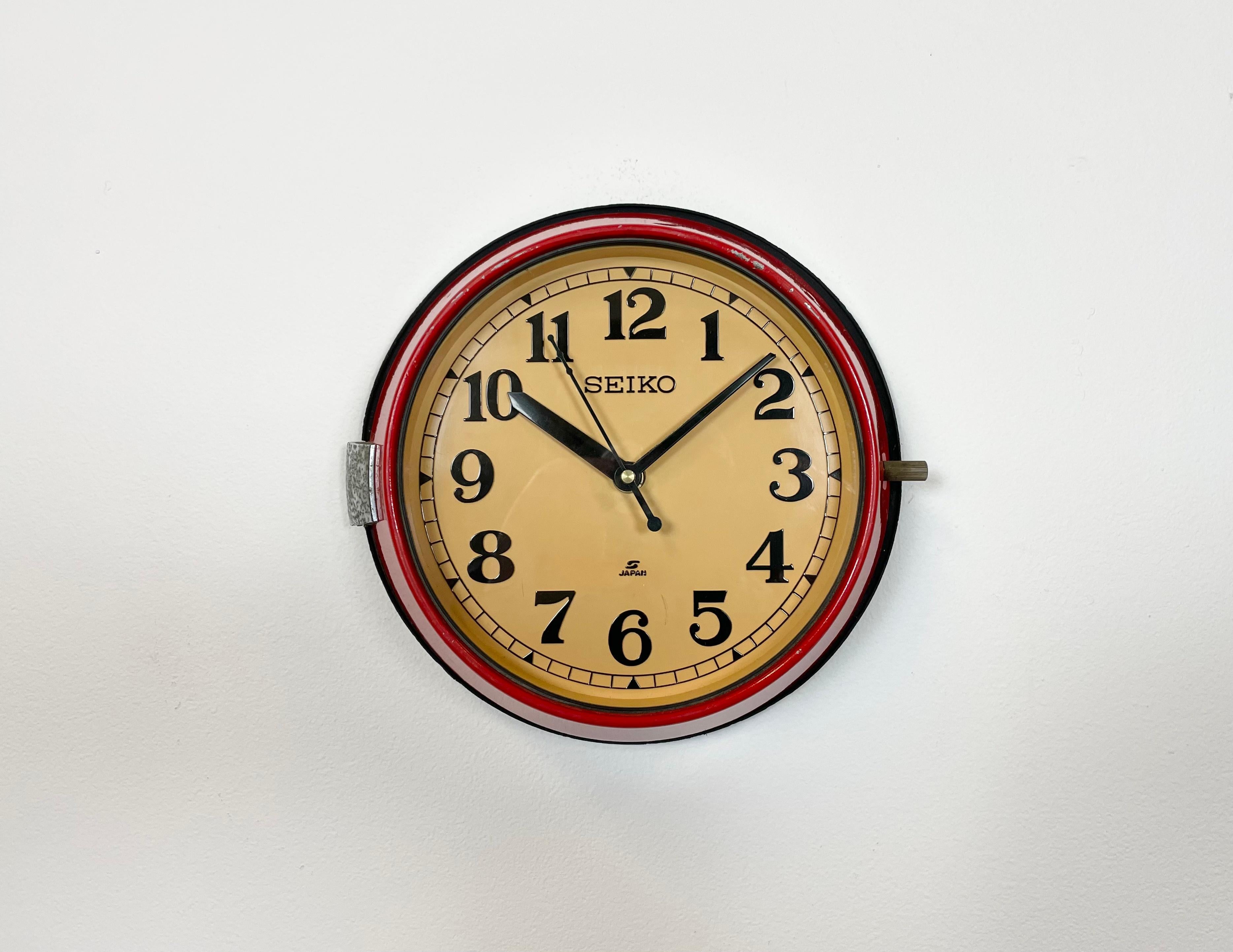 Vintage Seiko navy slave clock designed during the 1970s and produced till 1990s. These clocks were used on large Japanese tankers and cargo ships. It features a red metal frame, a plastic dial and clear glass cover. This item has been converted