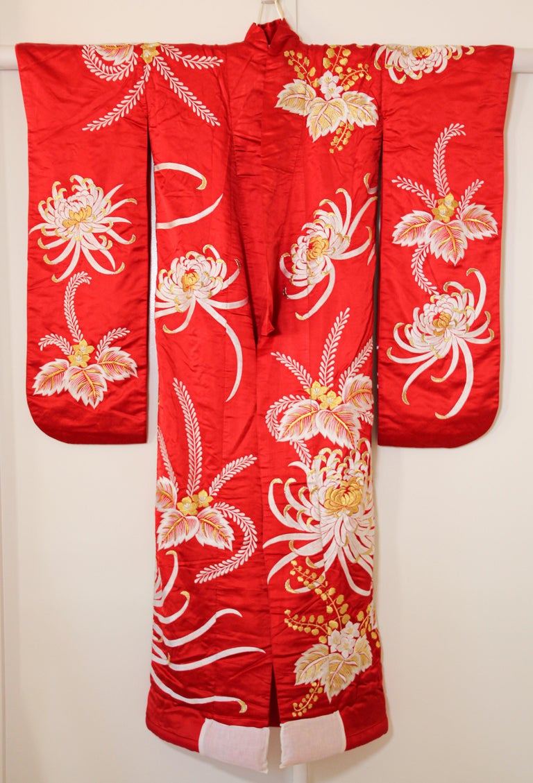 A vintage midcentury red color silk brocade collectable Japanese ceremonial wedding kimono. 
One of a kind handcrafted .
Fabulous museum quality ceremonial piece in pure silk with intricate detailed hand-embroidery throughout accented with gold
