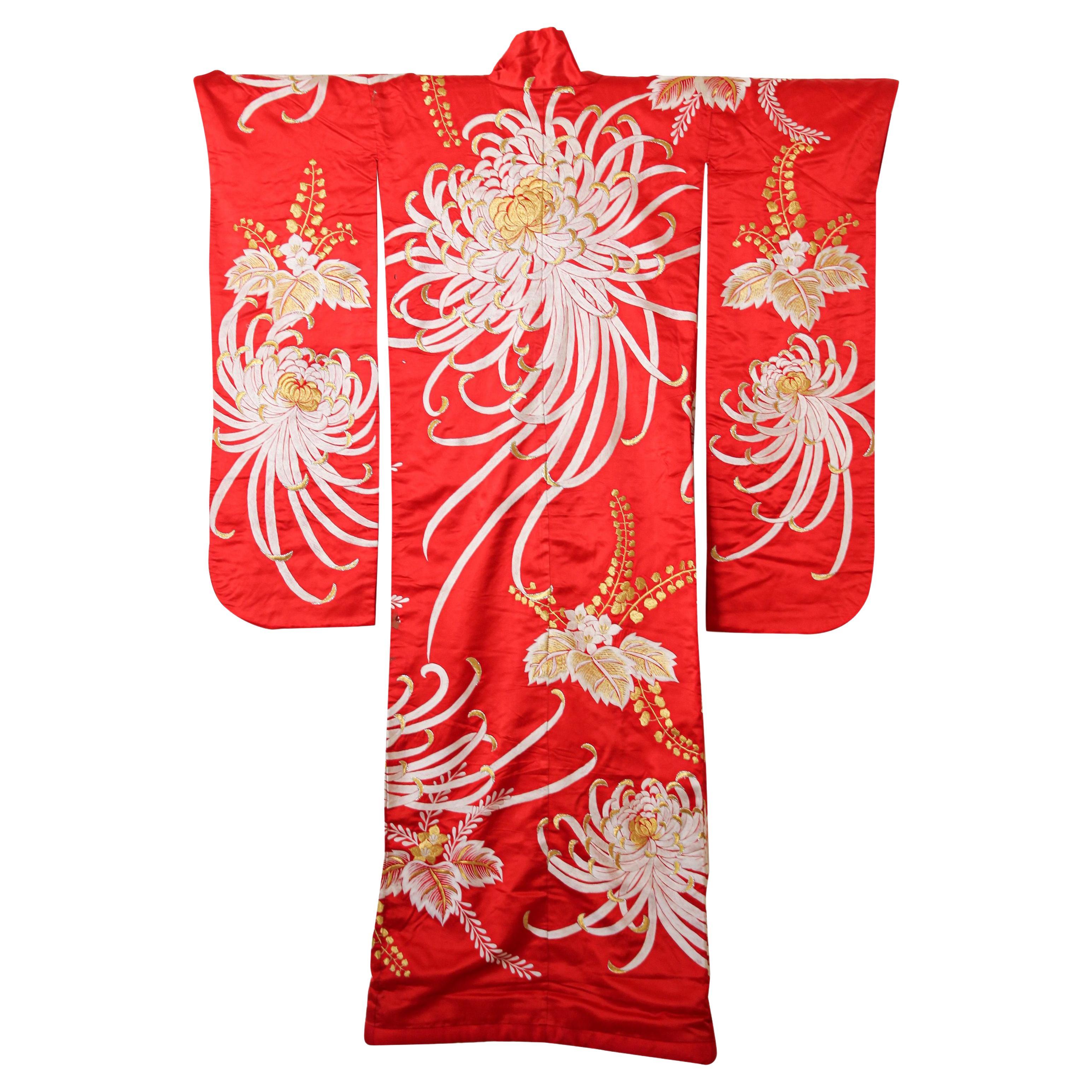 A vintage midcentury red color silk brocade collectable Japanese ceremonial wedding kimono. 
One of a kind handcrafted .
Fabulous museum quality ceremonial piece in pure silk with intricate detailed hand-embroidery throughout accented with gold lame
