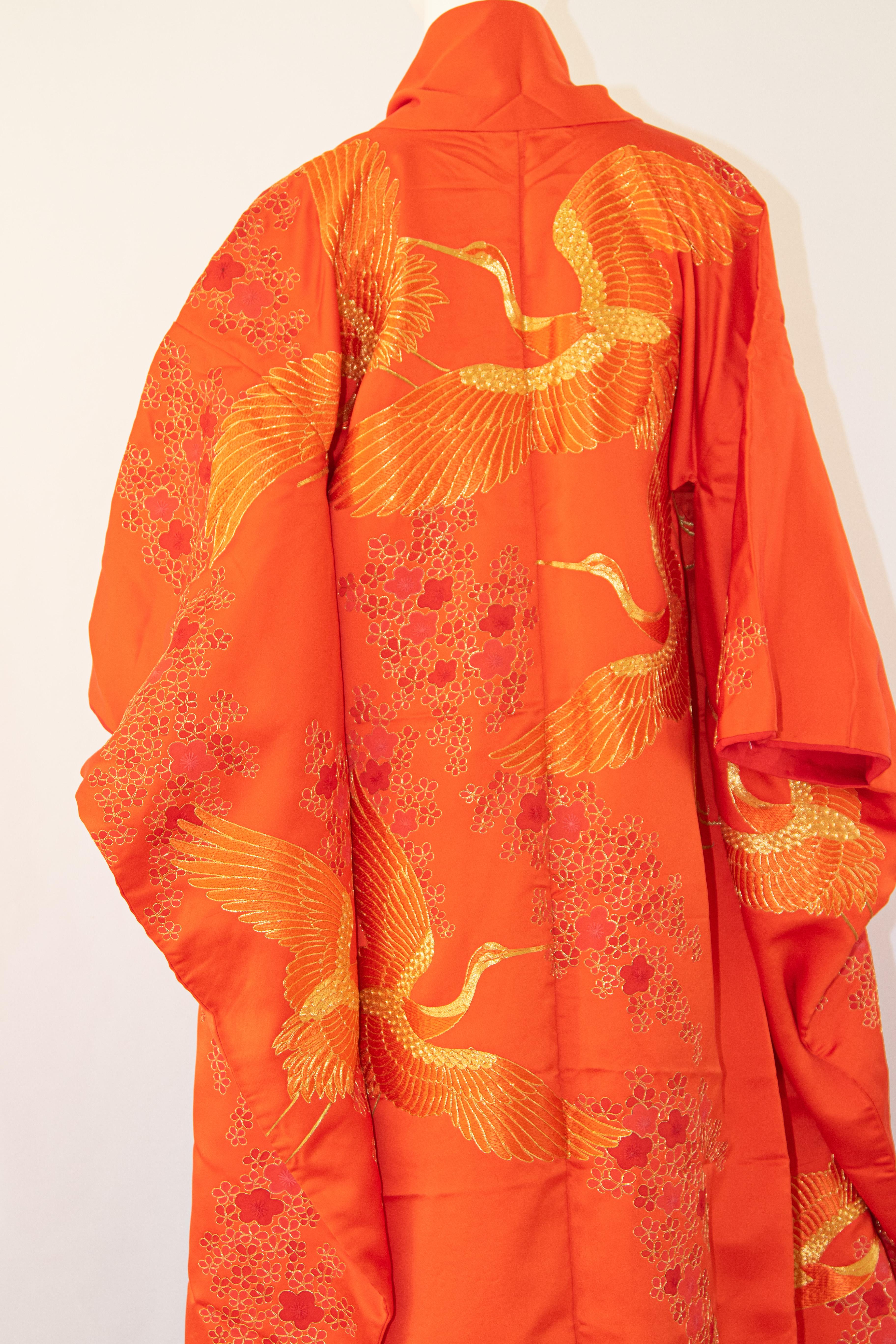 A vintage midcentury red silk brocade collectable Japanese ceremonial wedding kimono.
One of a kind handcrafted fabulous museum quality ceremonial piece in pure silk with intricate detailed hand-embroidery throughout accented with gold threads work 
