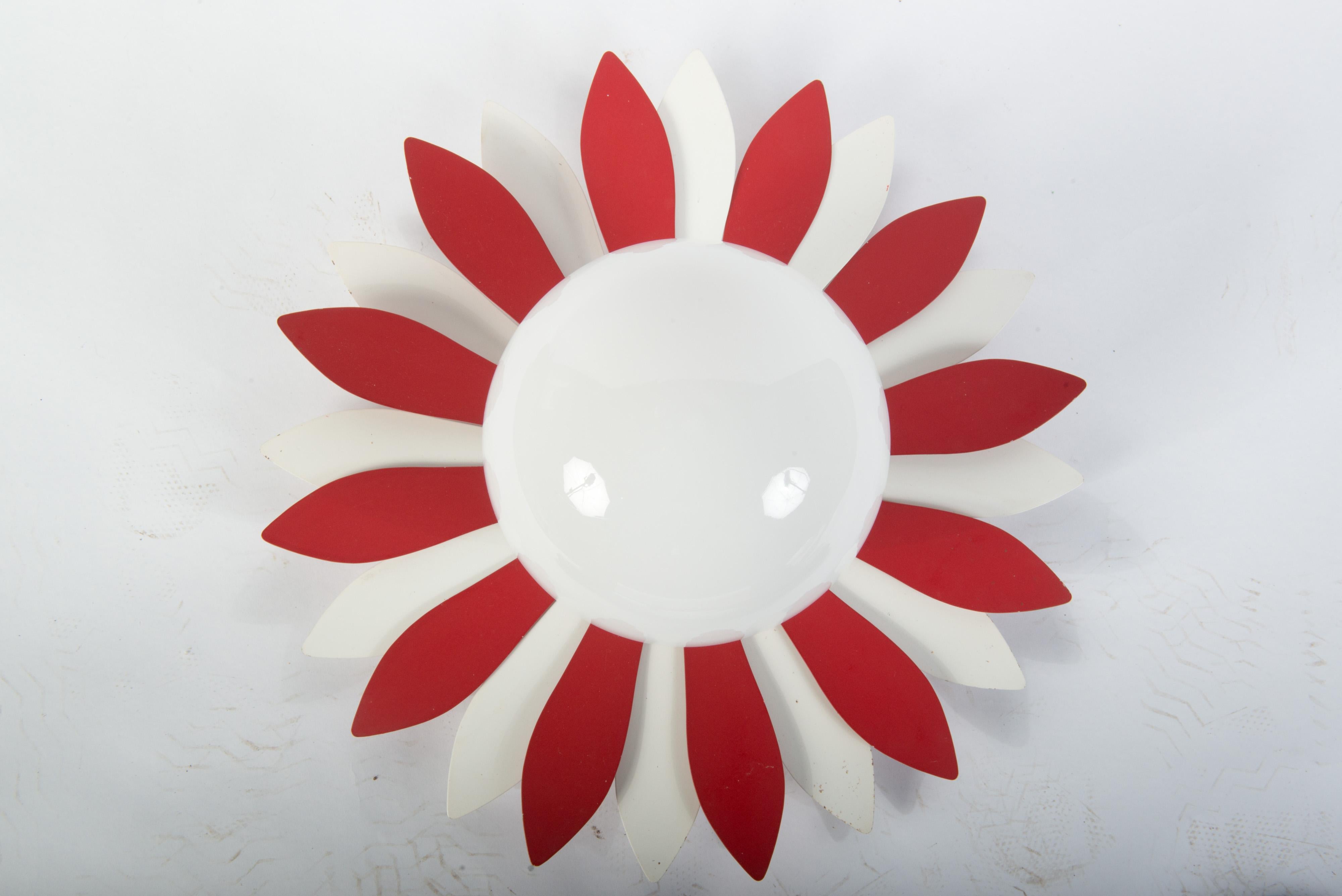 Unique vintage red and white metal flower petal ceiling light with milk glass globe. It could be adjusted to be wall mounted. Flower power!
