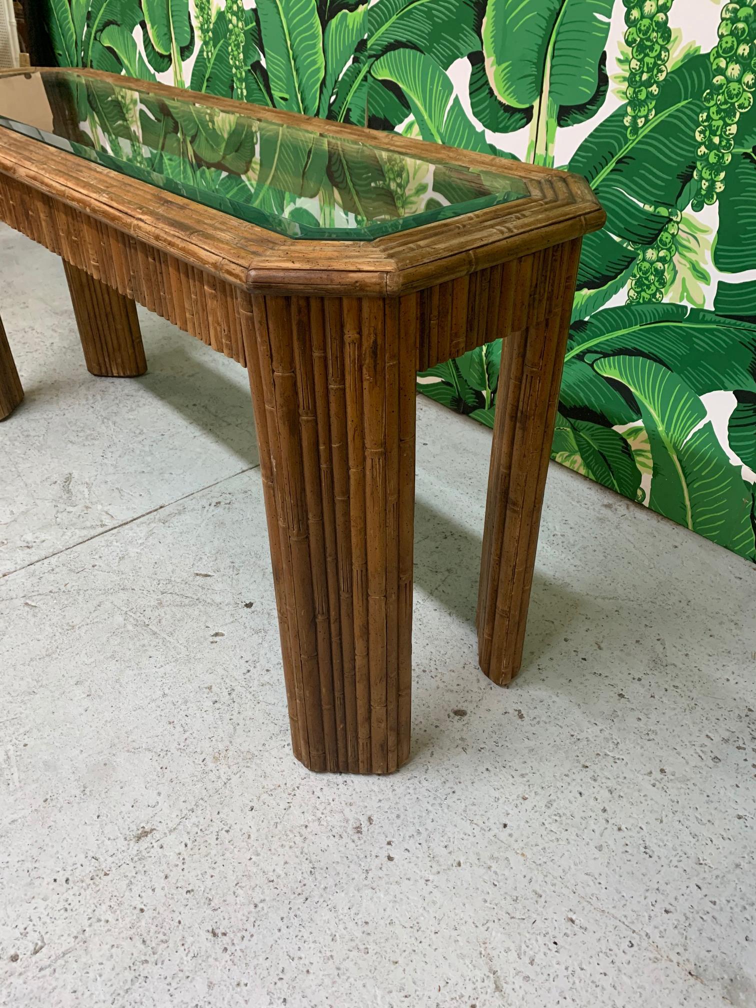 Vintage console table features full bamboo veneer and glass insert top. Good vintage condition with minor imperfections consistent with age.
 