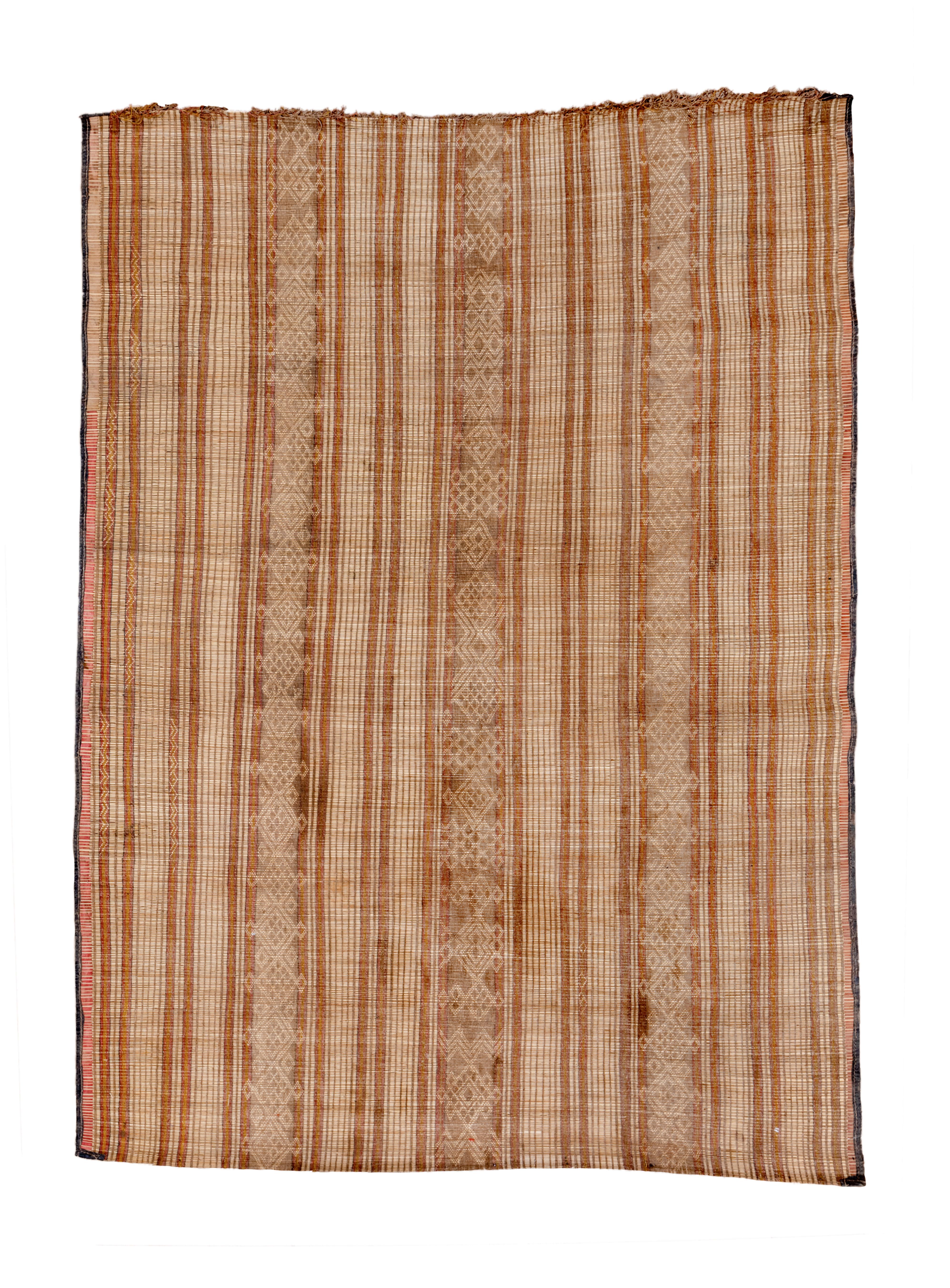 Rugs can be made out of virtually any available flexible material. Here the Tuareg tribesmen utilize riverbank reds in shades of brown and tan, to create a vertically striped piece with  three major diamond-patterned uprights, along with  narrower,