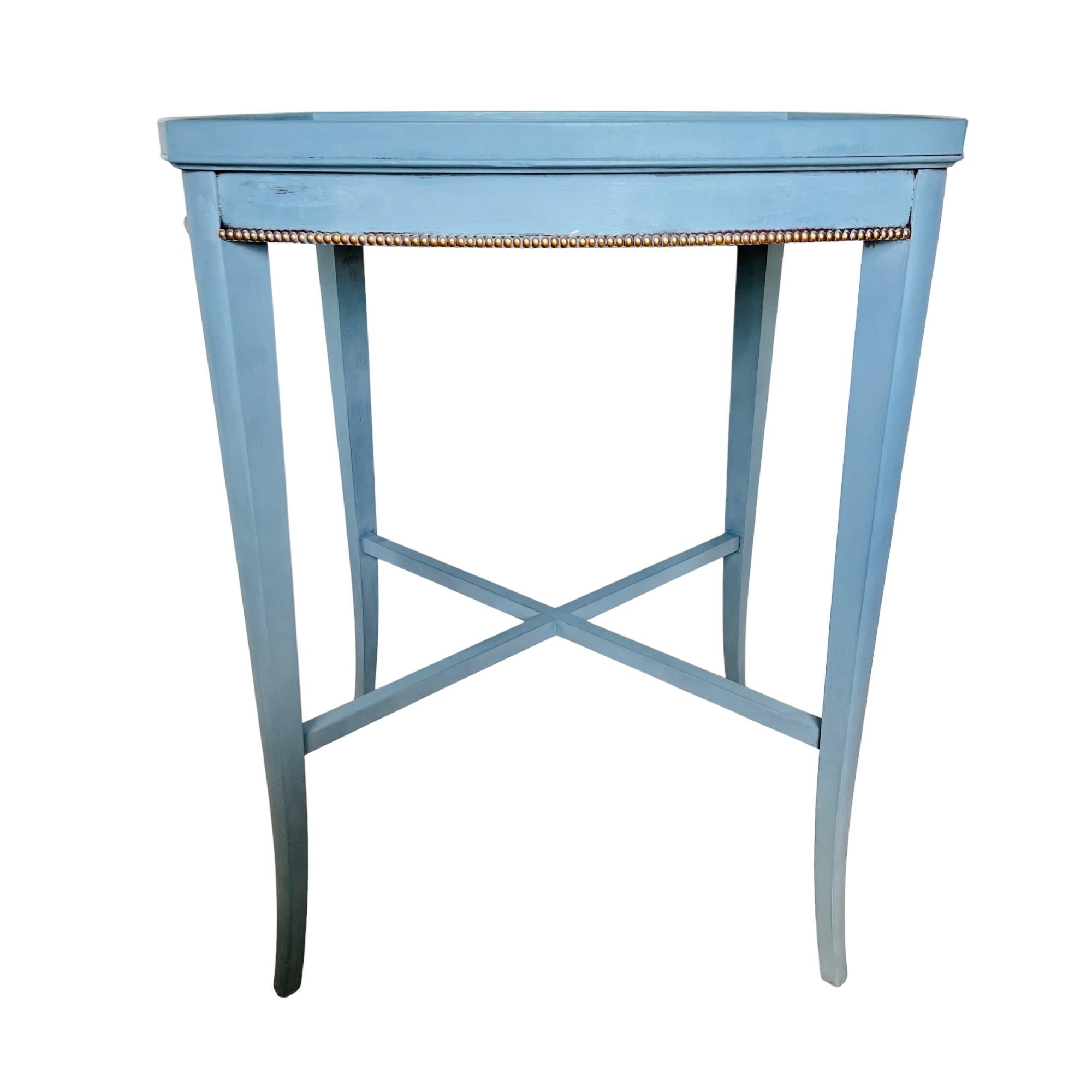 Elegant lines and fine details in a Classic color. This lovely vintage 1940s side table by Imperial Furniture of Grand Rapids has been refinished in French blue, accented with gold and has a slightly distressed look with the original mahogany finish