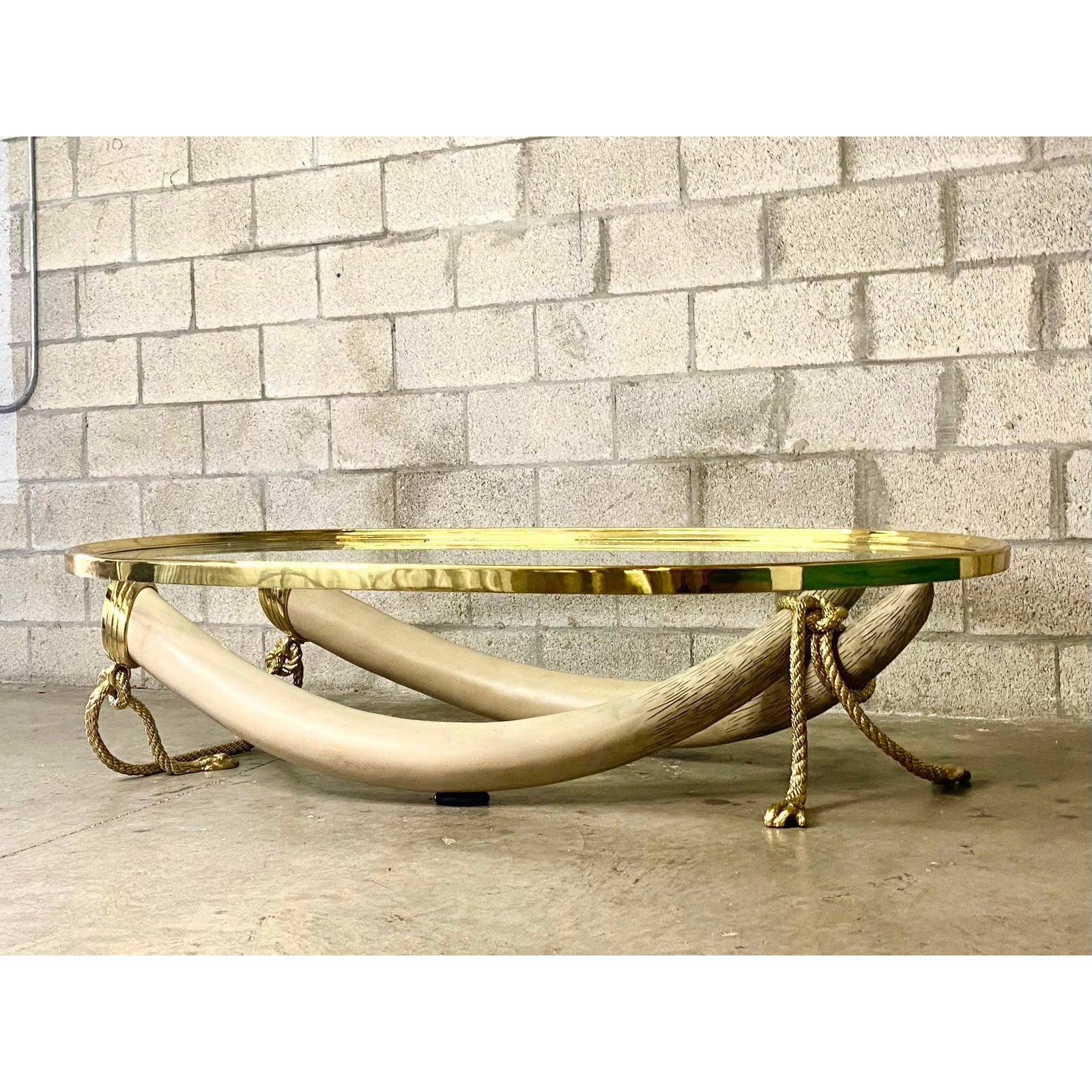 Vintage Regency 1970s Valenti Glass and Brass Faux Elephant Tusk Coffee Table In Good Condition In west palm beach, FL