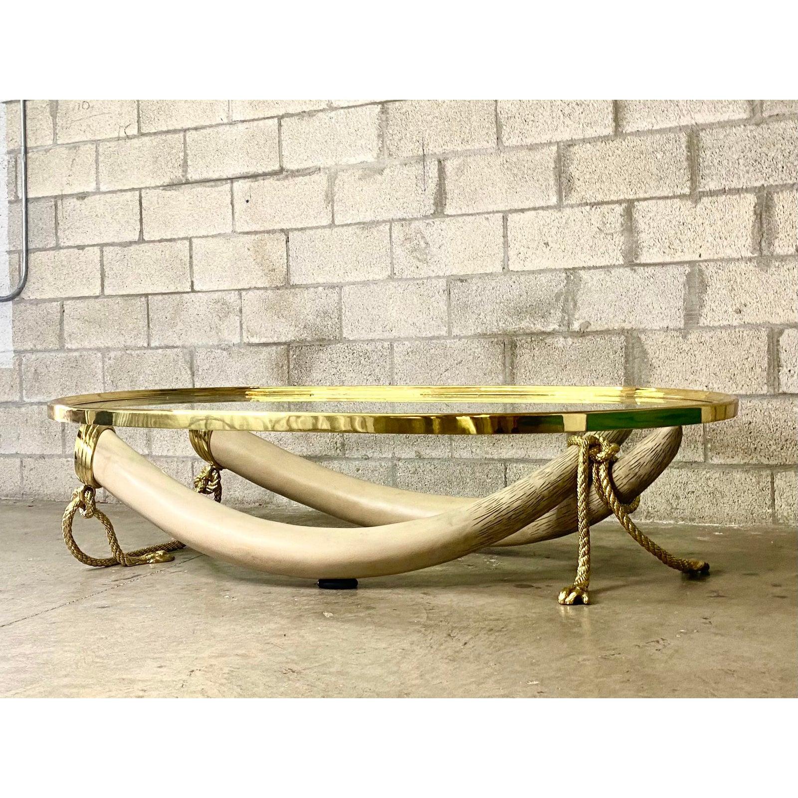 Vintage Regency 1970s Valenti Glass and Brass Faux Elephant Tusk Coffee Table In Good Condition In West Palm Beach, FL