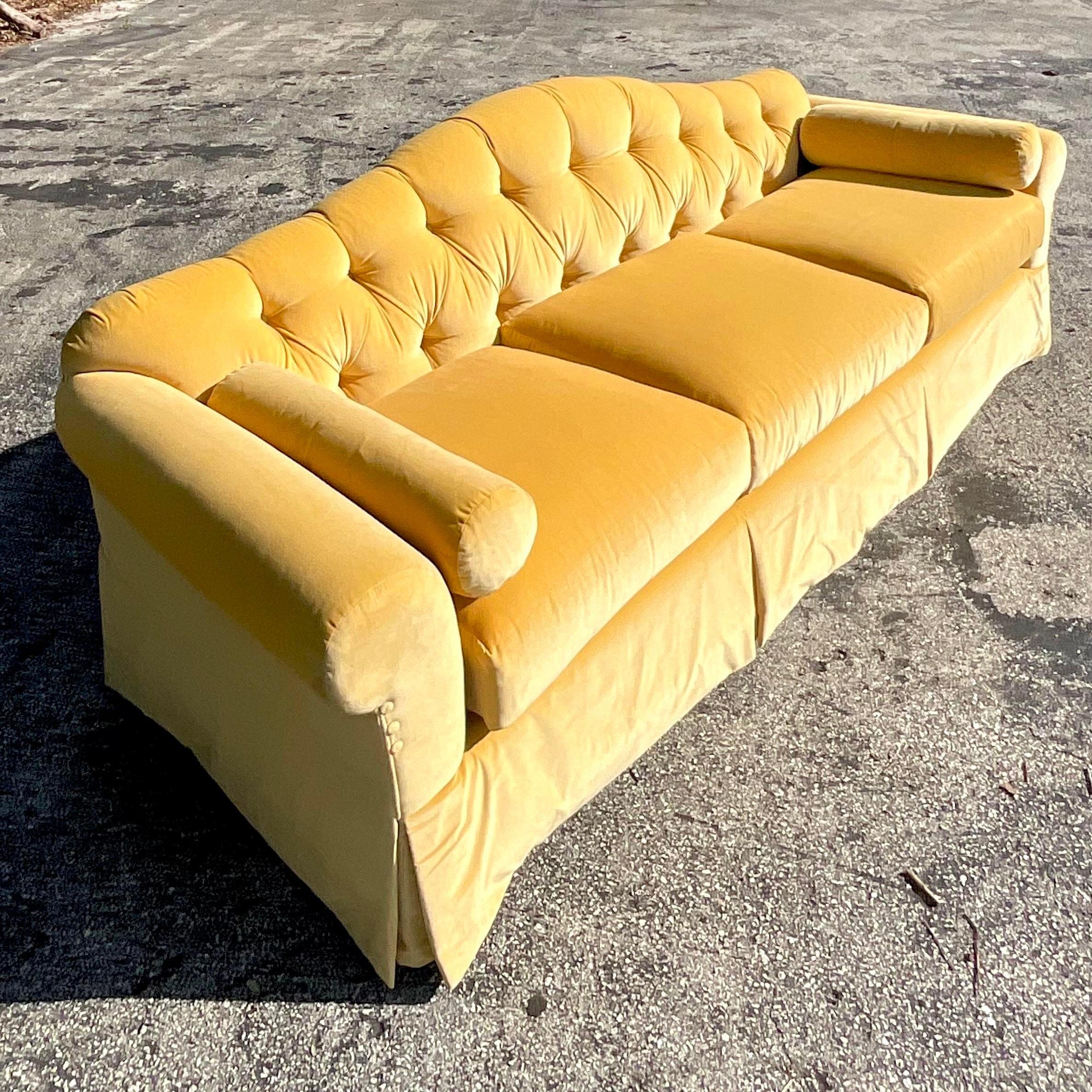 yellow tufted sofa