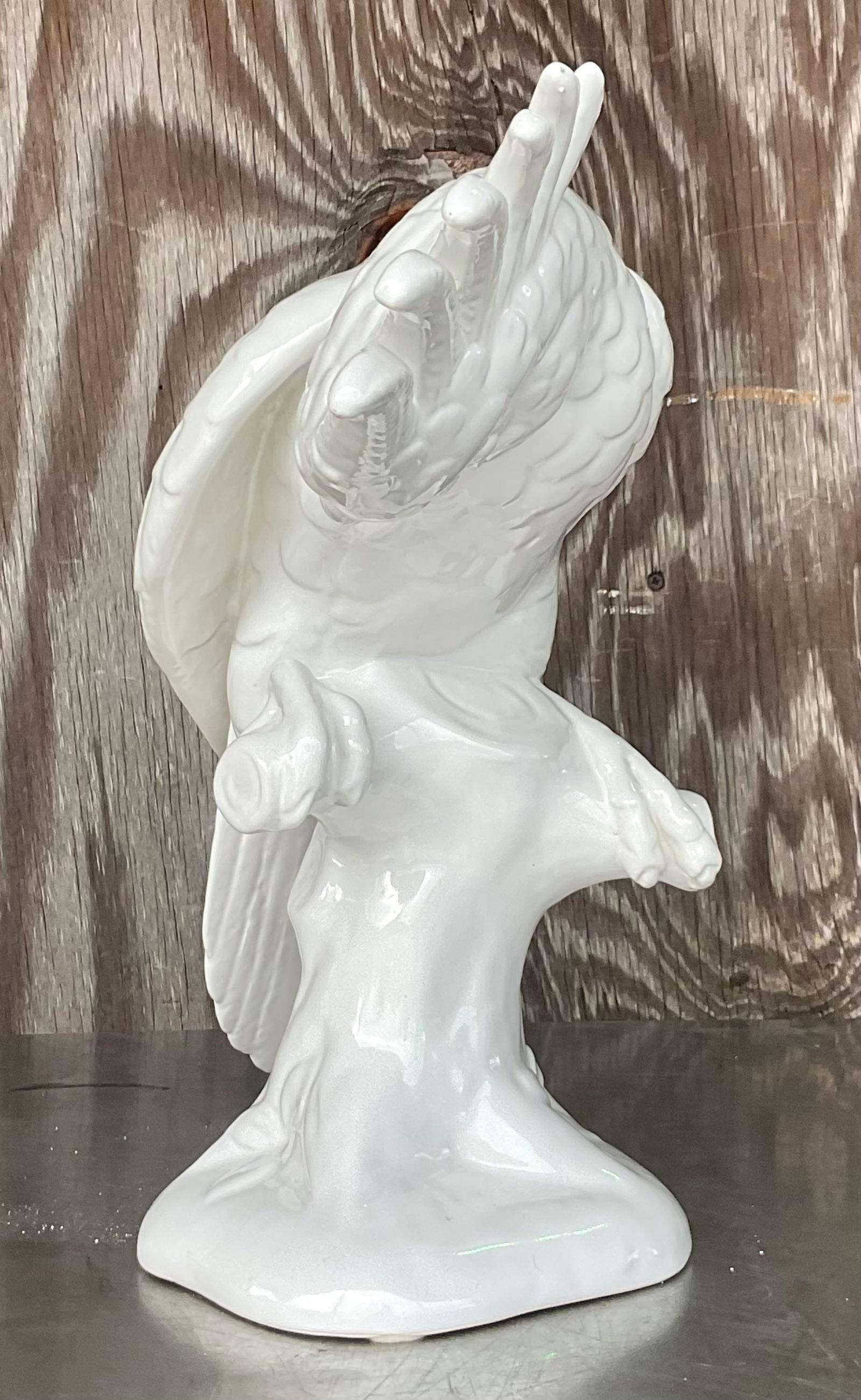 A fantastic vintage Regency large Cockatoo. A chic Blanc de Chine bird in a beautiful low pose. Made in Italy and marked on the bottom. Acquired from a Palm Beach estate.