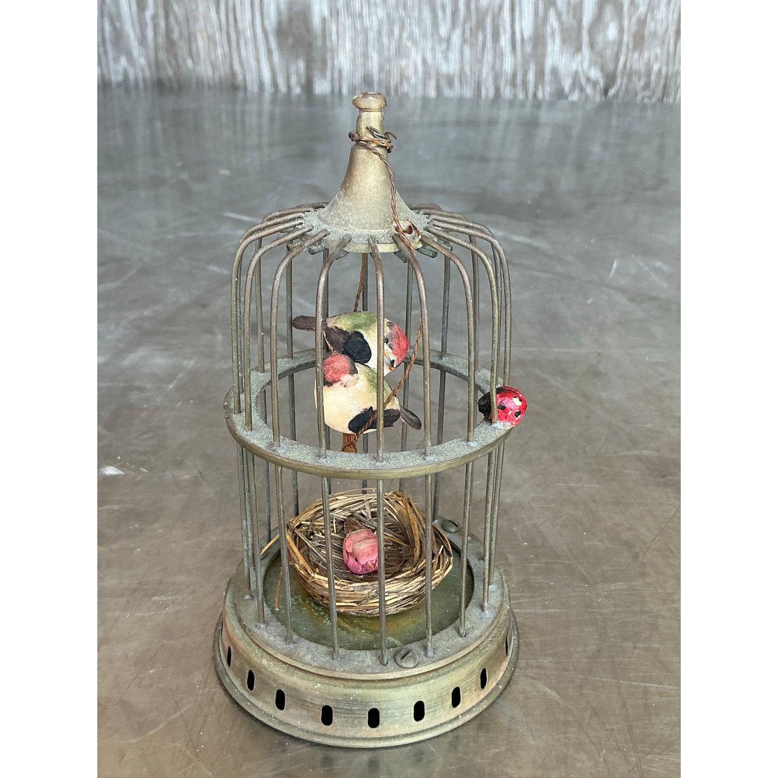 Charming and full of whimsy, this delightful pair of vintage Regency-style brass birdcages captures the nostalgic elegance of a bygone era. Each petite cage features intricate wirework, a soft antique brass patina, and lovingly detailed miniature