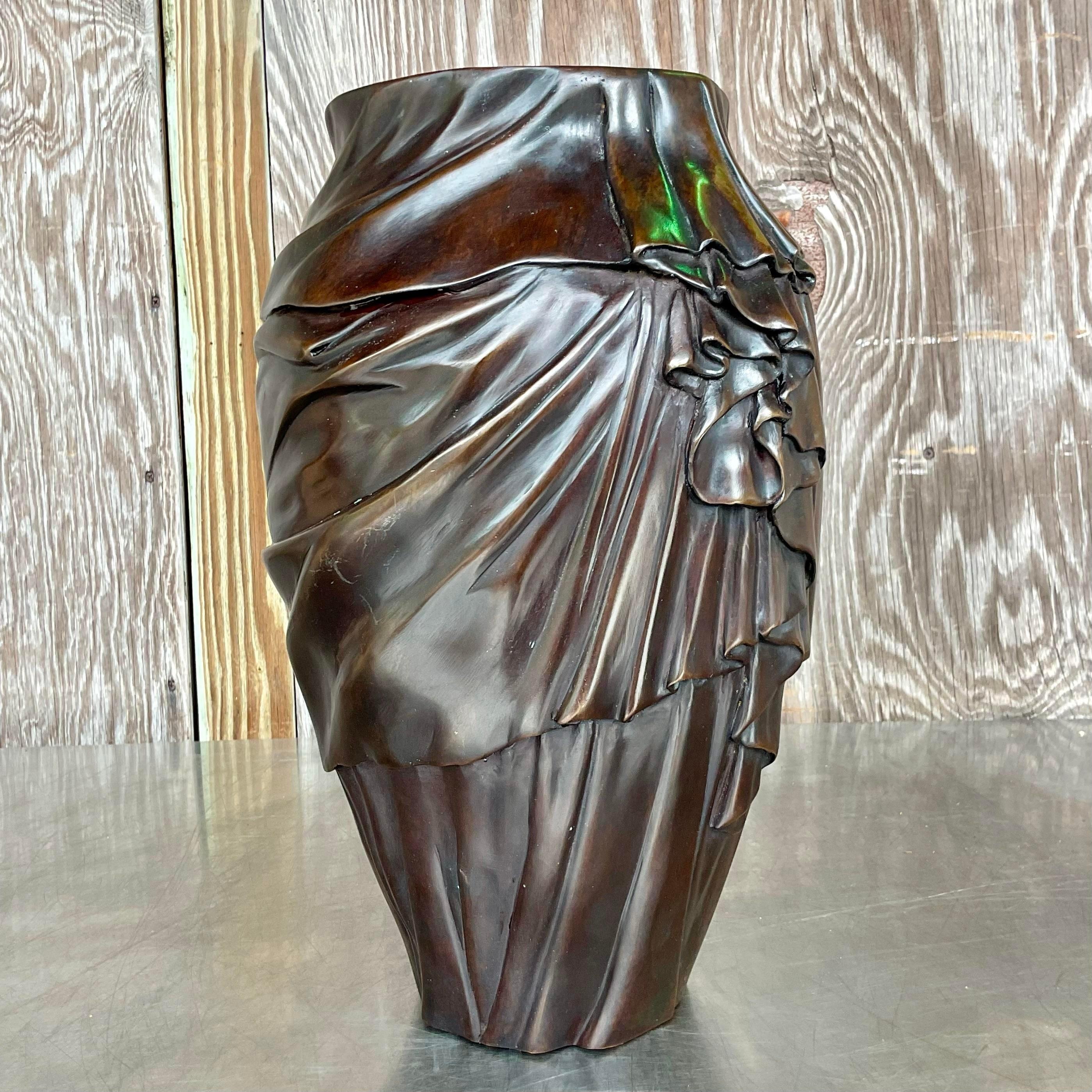A fabulous vintage Regency swag bronze vase. A chic gorgeous swag detail that wraps around the back. Perfect for a large floral bouquet for huge drama. Acquired from a Palm Beach estate