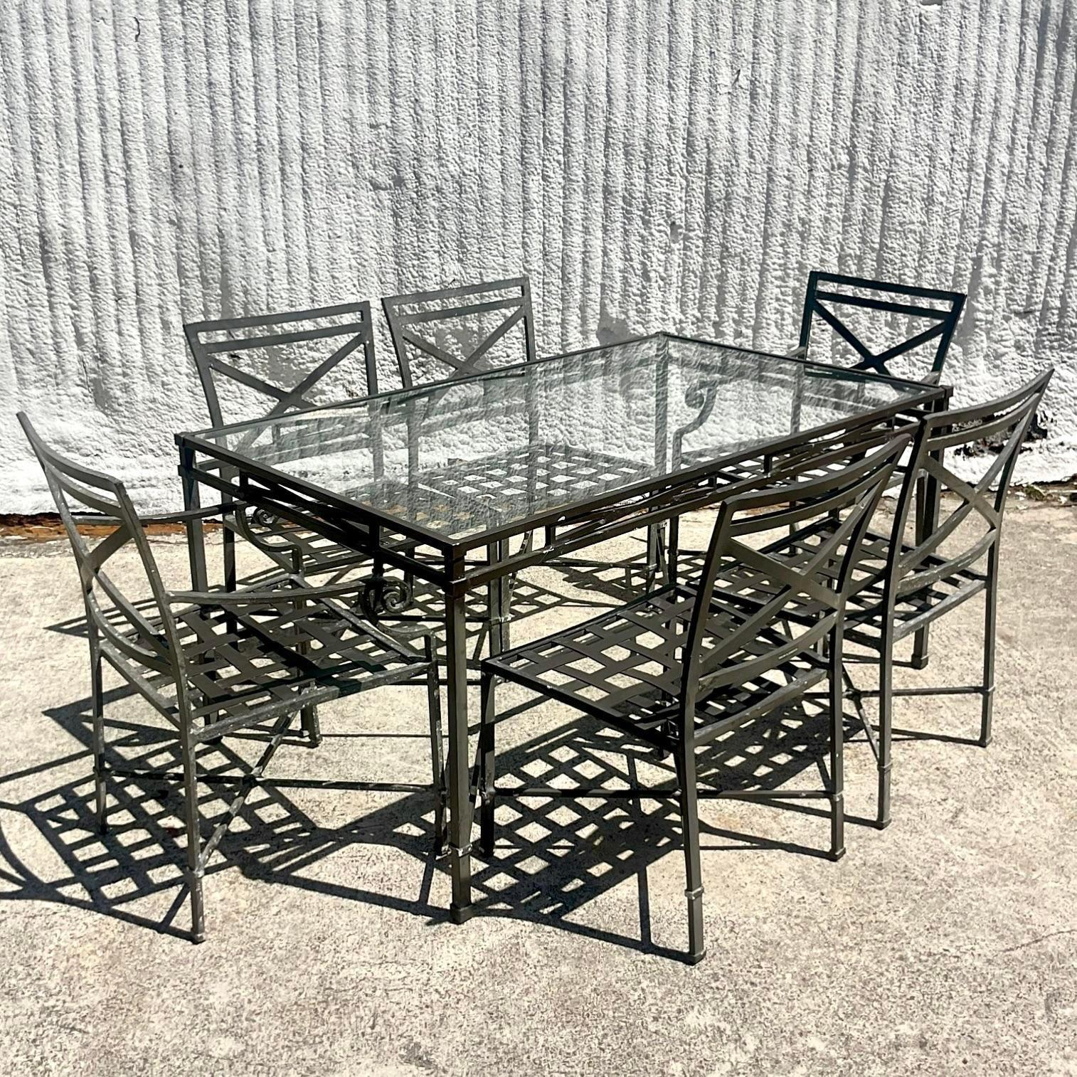 A stunning set of vintage Regency dining table and chairs. Made by the iconic Brown Jordan. Part of their highly coveted “Venetian” collection. Six chairs, 2 arms and four sides, with matching table. Acquired from a Palm Beach estate.

Measures: