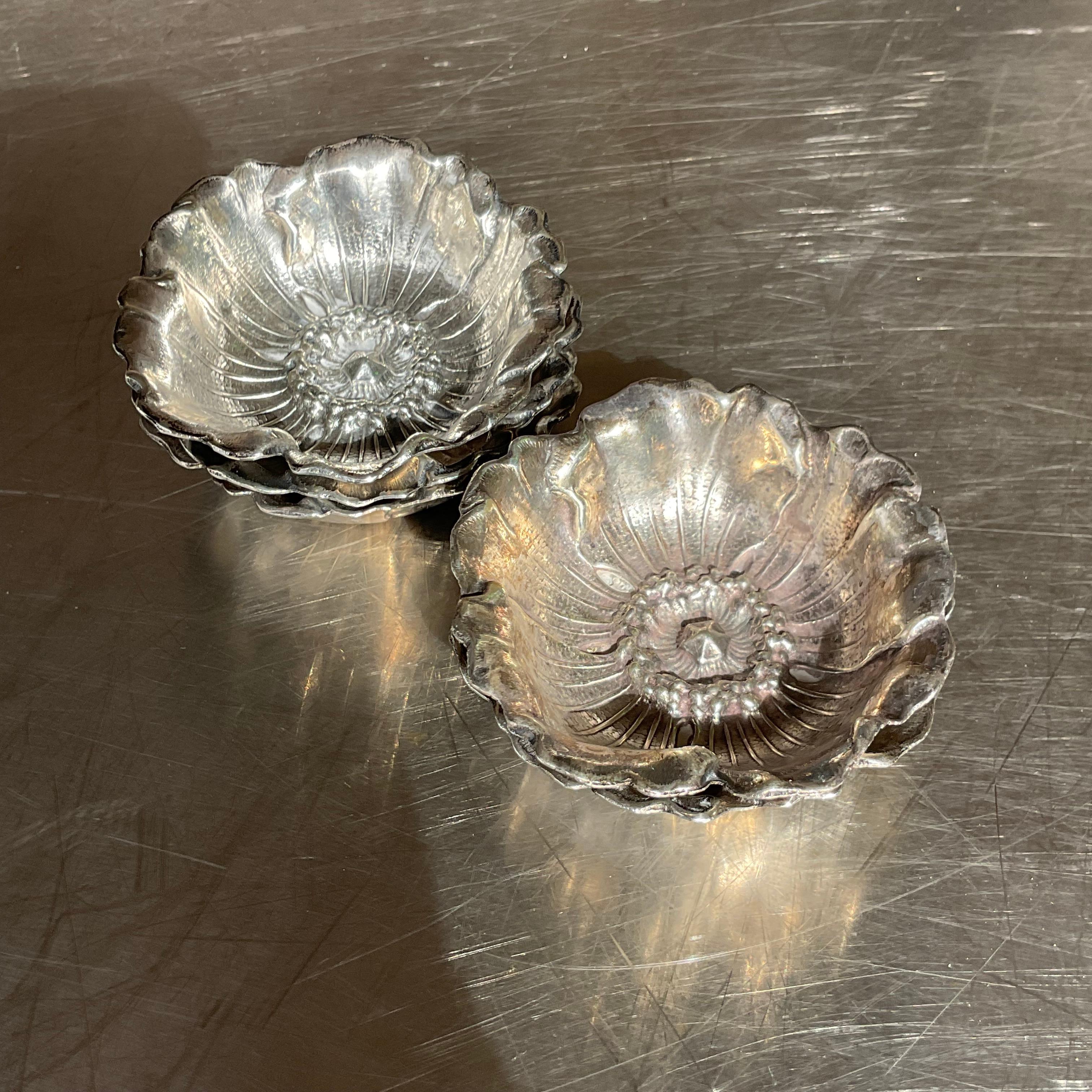 A fabulous set of five vintage Regency salt cellars. Made by the iconic Buccellati group and marked on the bottom. Their coveted Poppy design in the small size. Acquired from a Palm Beach estate