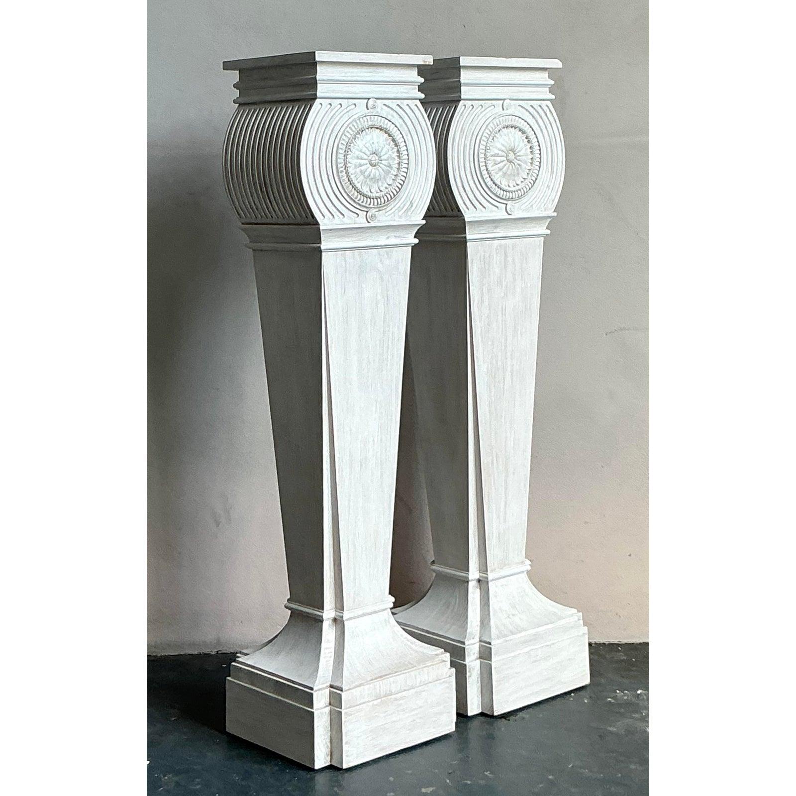 Elevate your interior with this distinguished pair of Vintage Regency Style Pedestals from Bunny Williams Home. These exceptional pieces capture the timeless elegance and sophisticated charm characteristic of the Regency era, reinterpreted with