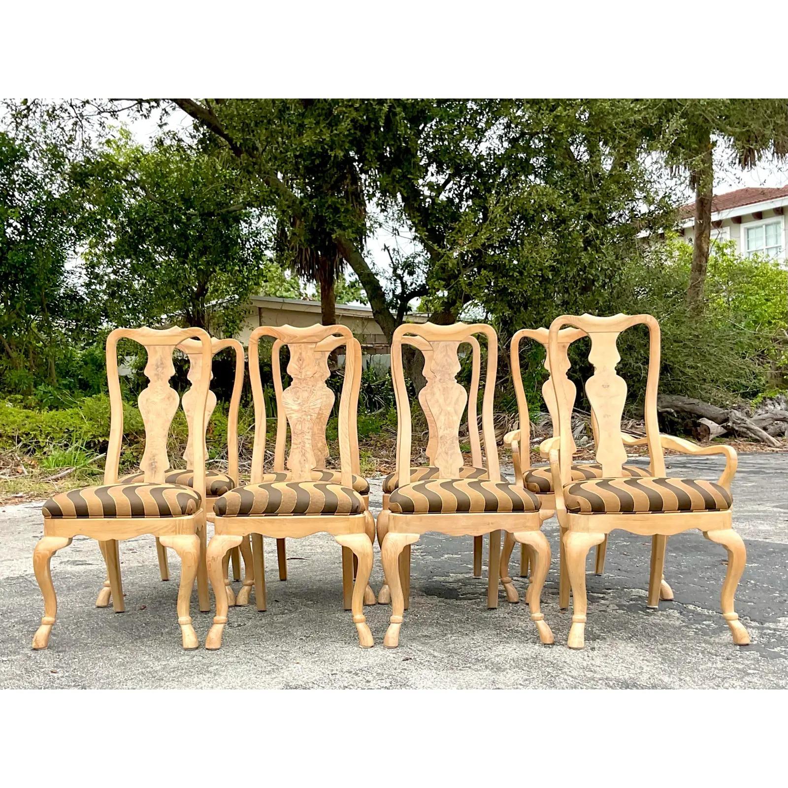 An outstanding set of 8 vintage Regency dining chairs. Chic high backs and carved cabriolet legs. Beautiful Burl wood grain detail. A wavy jacquard with a touch of lurex. Acquired from a Palm Beach estate.

armchair width 23.5