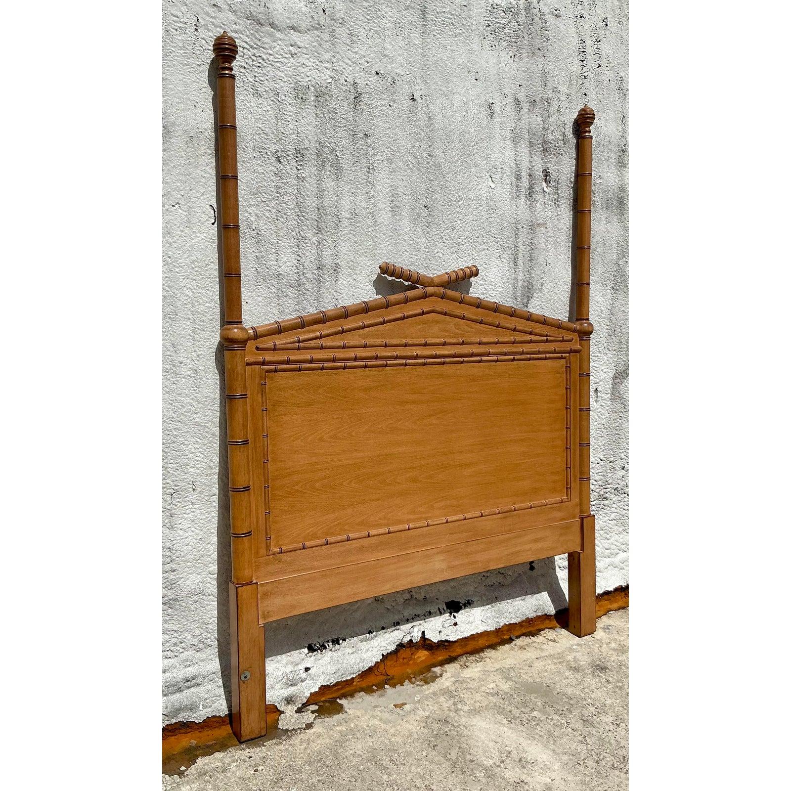 Transform your bedroom into a sanctuary of refined elegance with this exquisite Vintage Regency Carved Bamboo Queen Headboard. This majestic piece boasts a striking silhouette, featuring meticulously carved faux bamboo detailing that perfectly